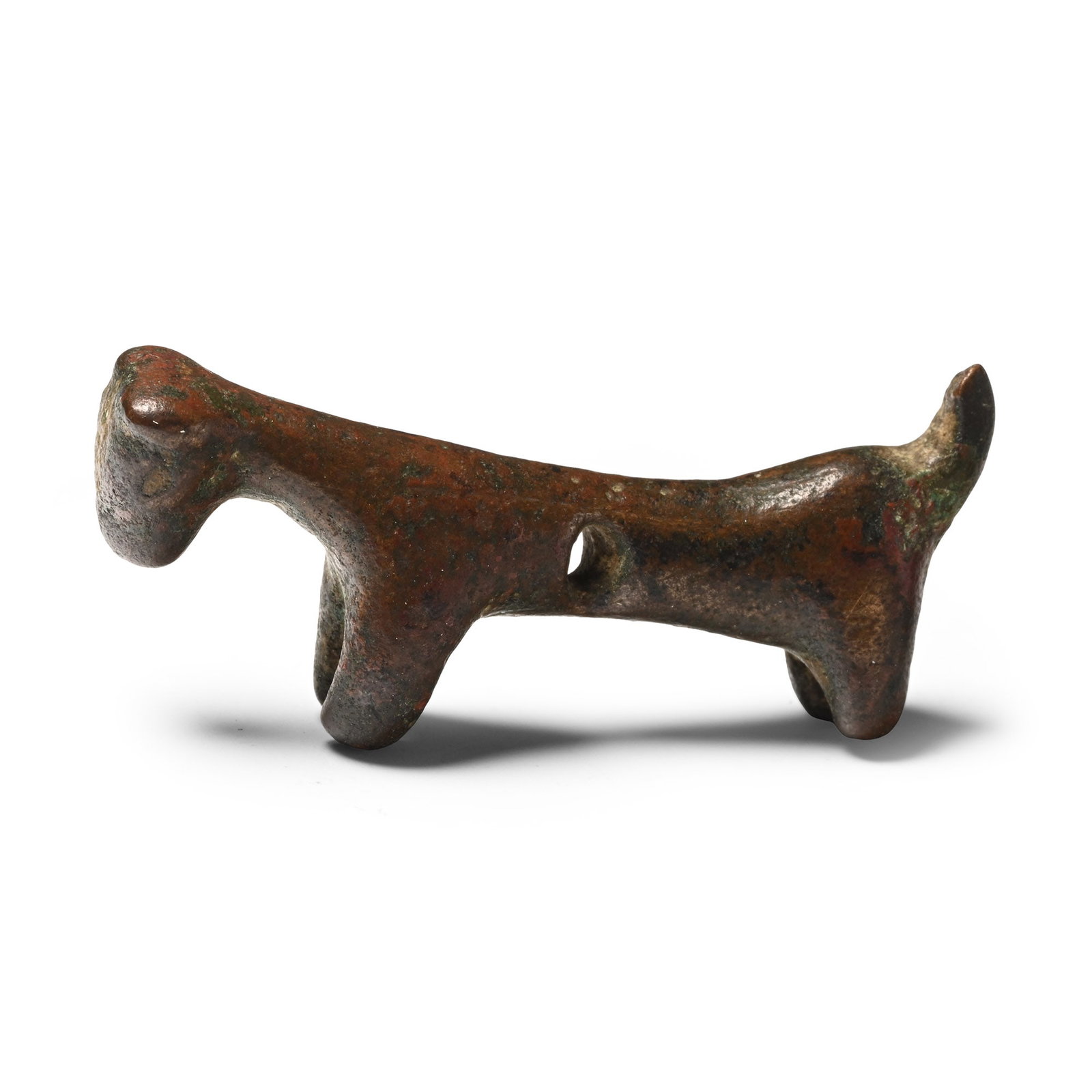 Etruscan Bronze Animal Figure: Circa 6th century B.C. Modelled with an elongated body and raised tail, a small head with pricked ears, and pierced through the body. 17 grams, 44 mm (1 3/4 in.). [No Reserve] From the private collect