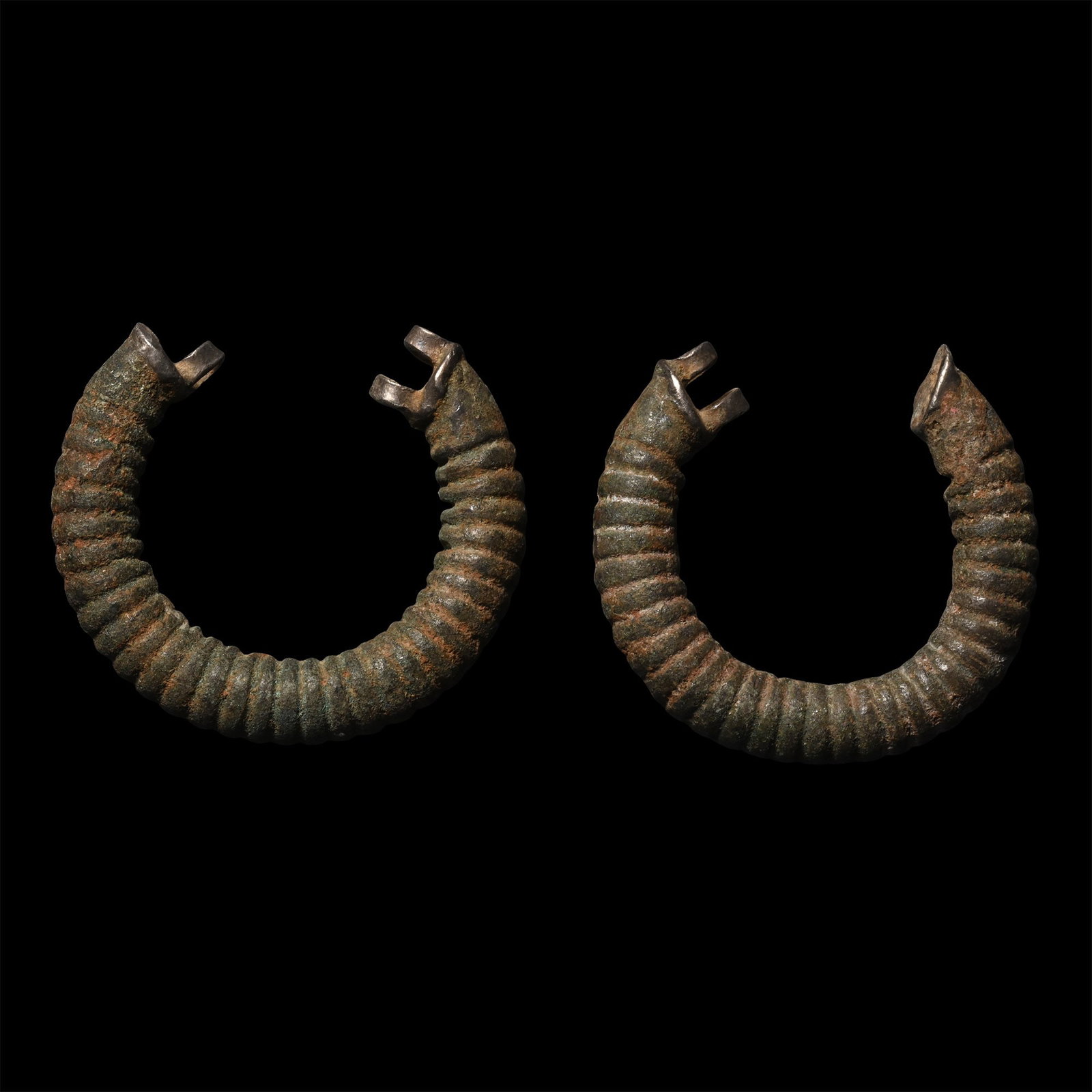 Greek Silver Earring Pair: Circa 4th-2nd century B.C. Matched pair of ribbed crescents with loops. 22.5 grams total, 27-29 mm (1 in.). [2, No Reserve] From the private collection of a European gentleman (1942-2024), formed sinc
