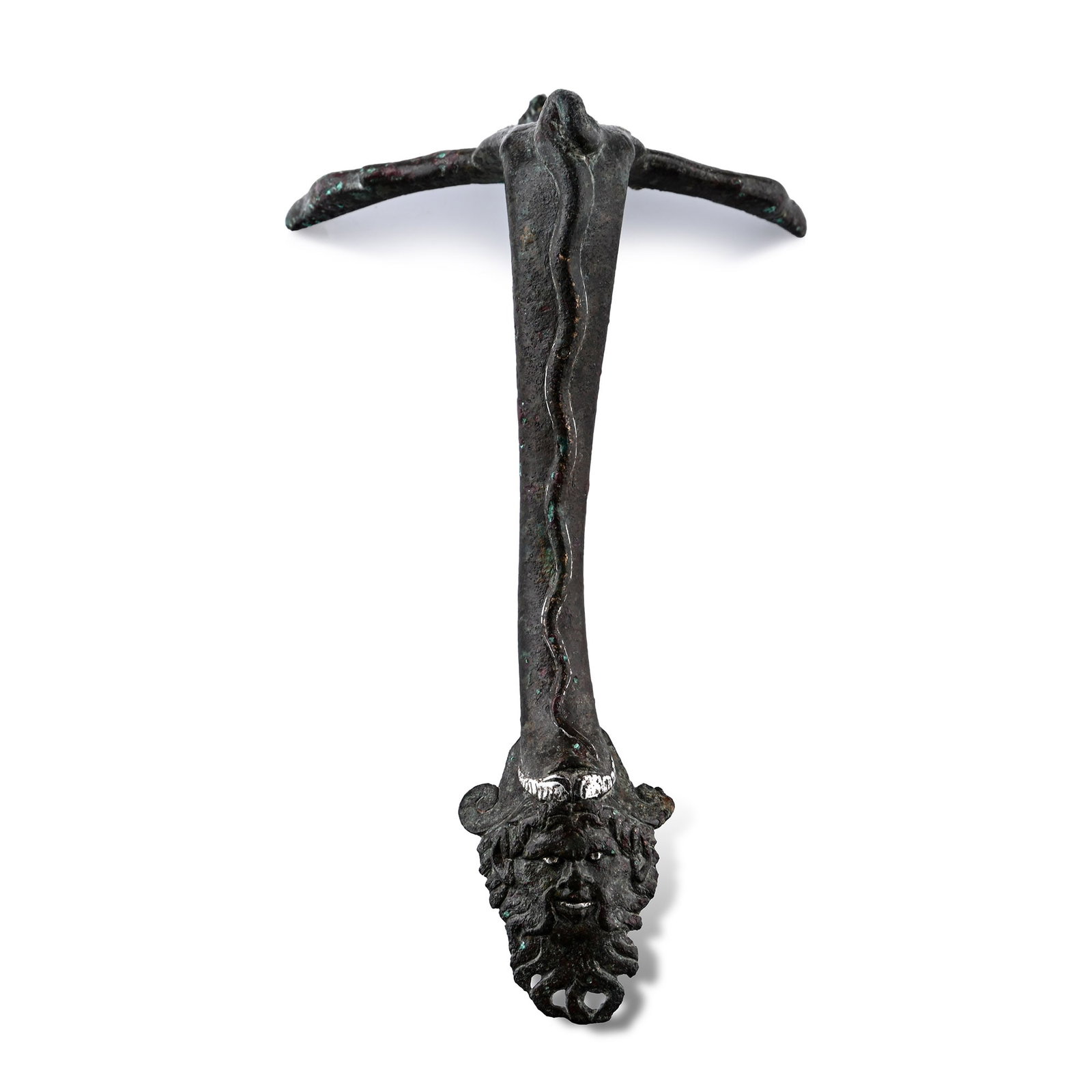 Roman Bronze Vessel Handle with Silver Inlaid Face: 1st century A.D. Swept in profile comprising a horizontal crescentic panel to attach to the rim, with inlaid silver detailing, recurved cobra-shaped thumb pad, raised serpent to the outer face of the 