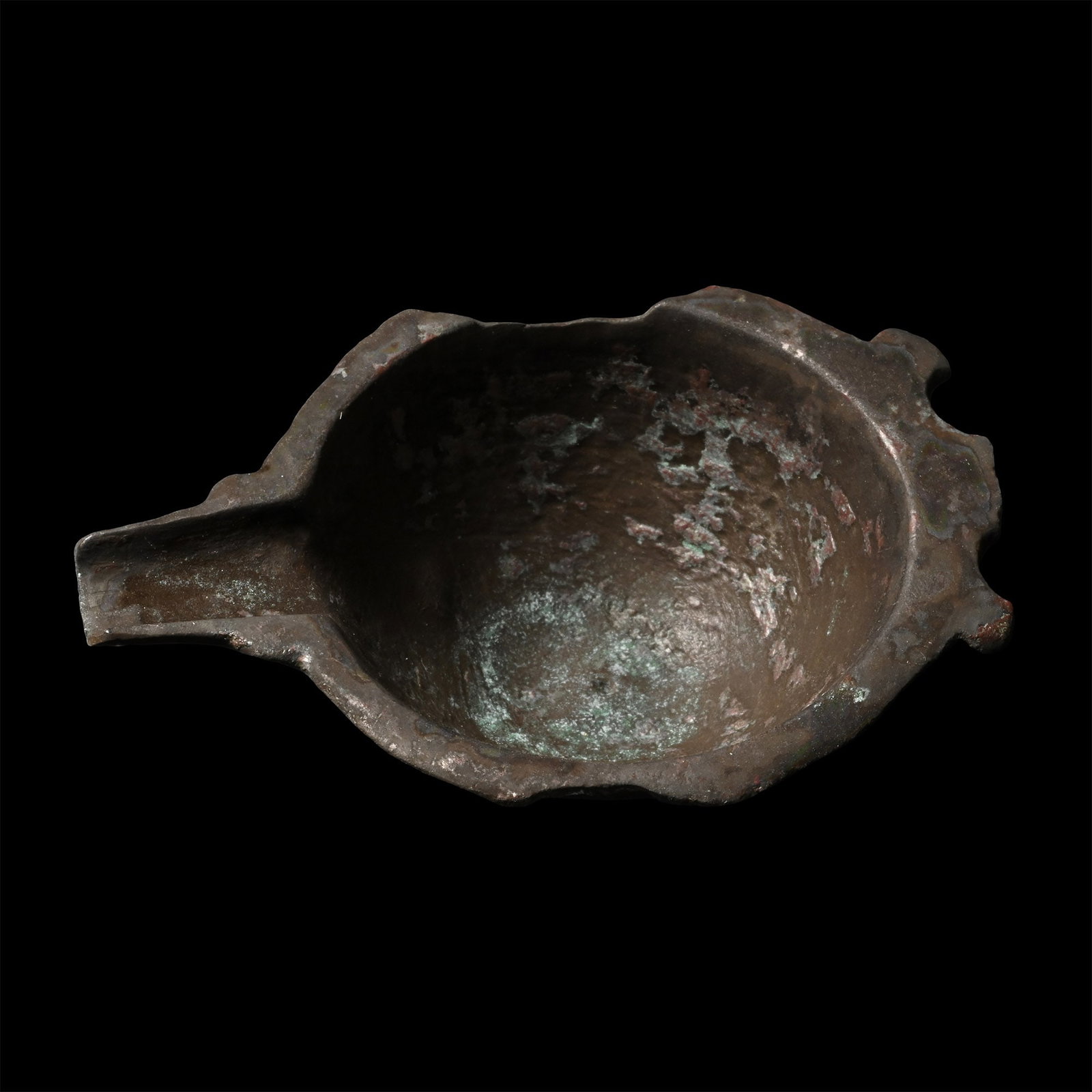 Late Roman Bronze Oil Lamp Filler: Circa 5th-7th century A.D. Comprising a deep body with shallow foot, flared rim with a U-shaped spout. 34.5 grams, 74.4 mm (2 7/8 in.). [No Reserve] From the private collection of Mr Brian Edwards, Ne