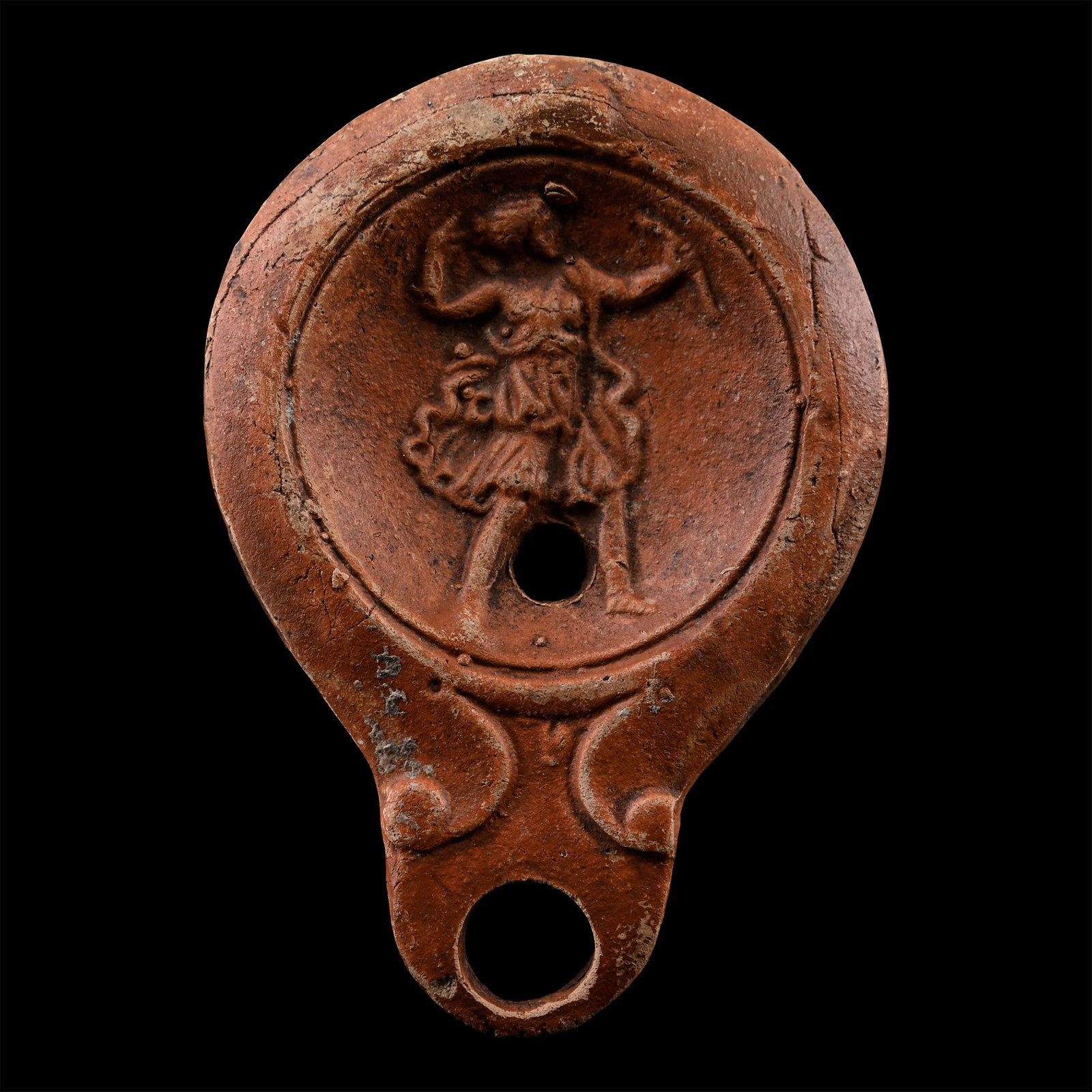 Roman Terracotta Oil Lamp with the Goddess Diana: Circa 1st-2nd century A.D. Round body with volute nozzle, narrow shoulder, discus with low-relief image of Diana shooting her bow. 58.5 grams, 95 mm (3 3/4 in.). [No Reserve] From the private collecti