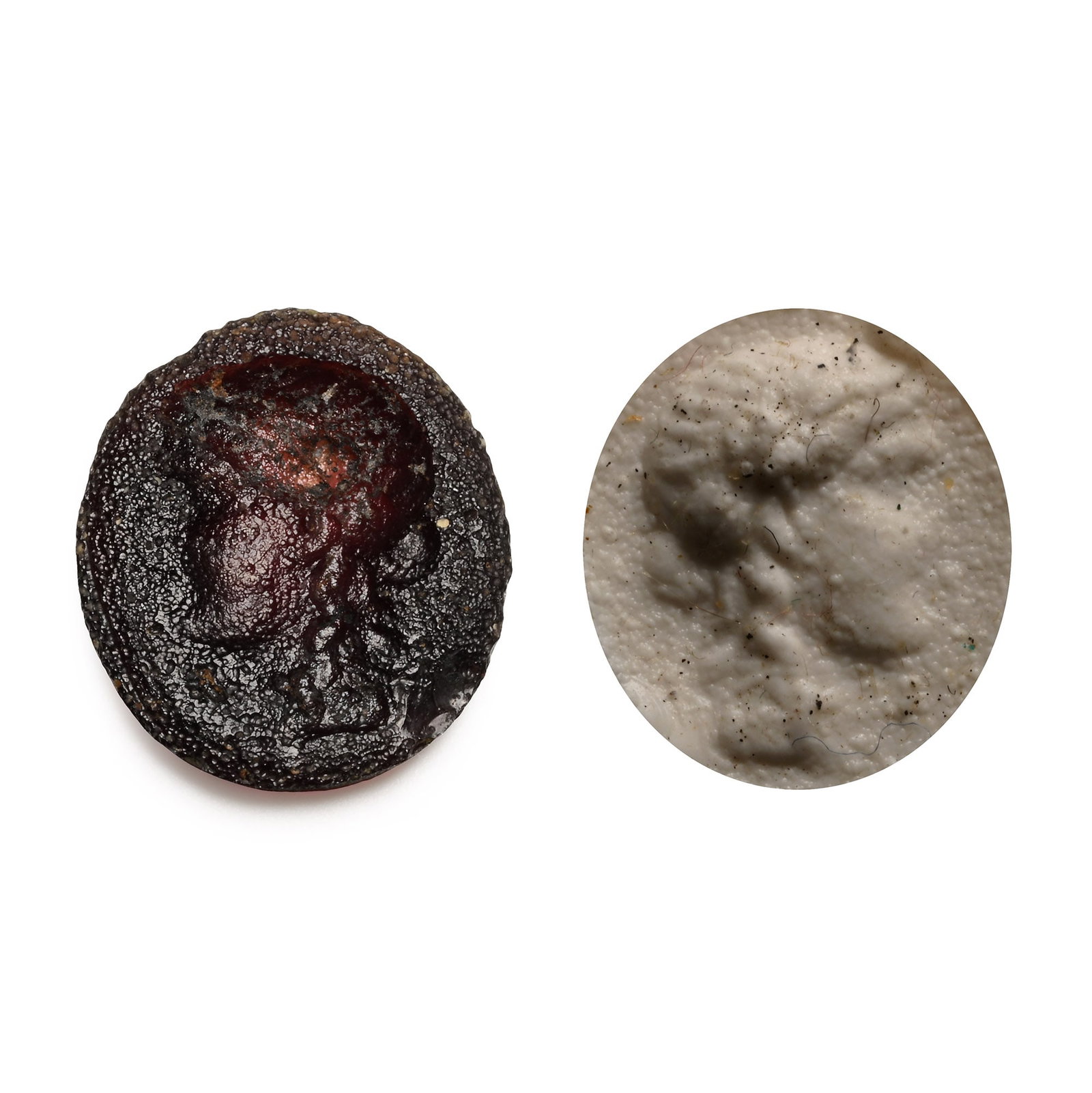 Roman Glass Gem with Female Bust: 2nd-3rd century A.D. With intaglio female bust in profile with wreath to the brow; supplied with a museum-quality impression. 0.48 grams, 13.38 mm (1/2 in.). [No Reserve] From the private collection o