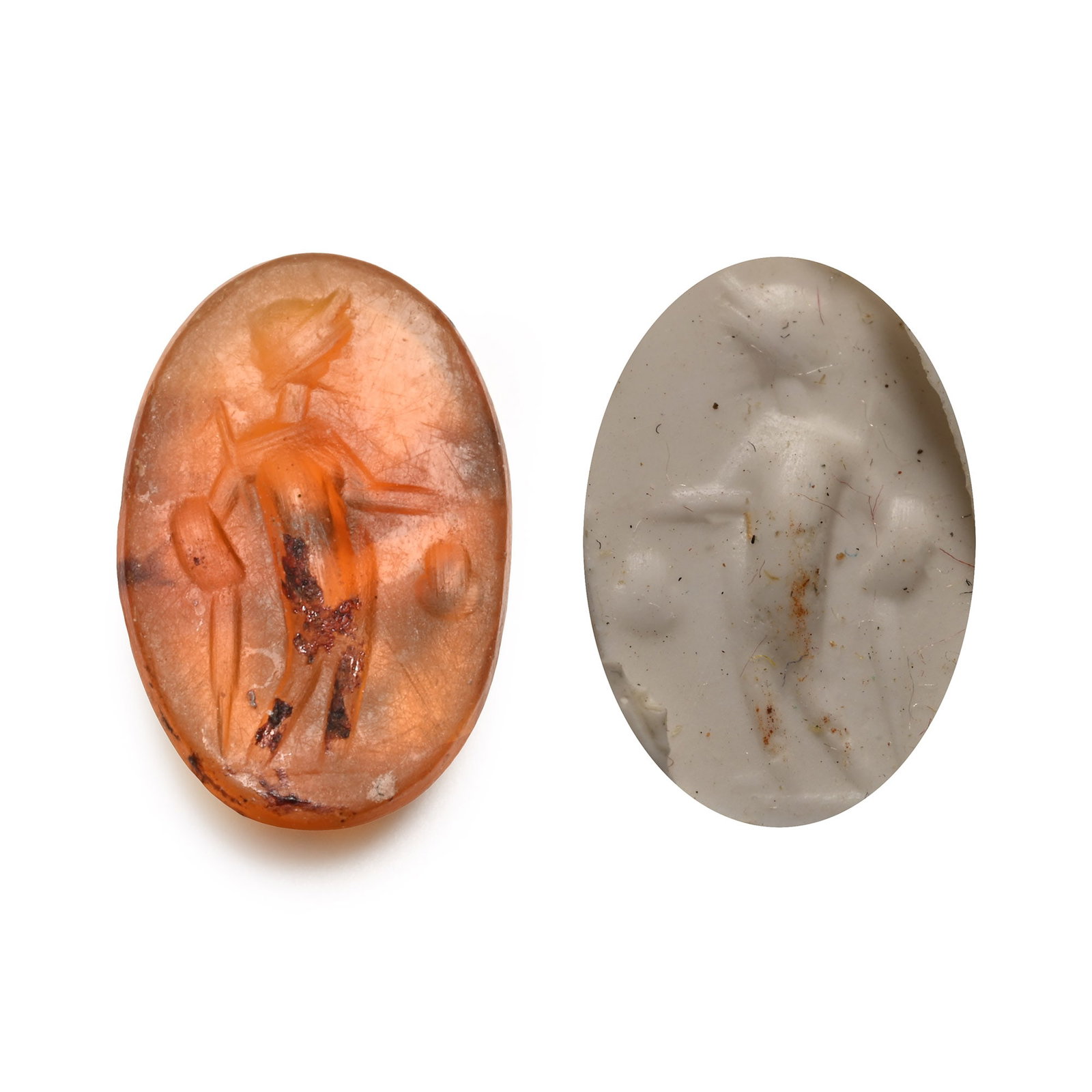 Roman Carnelian Gemstone with Mercury: 2nd-3rd century A.D. With intaglio standing male holding a container, possibly Mercury with the marsupium; supplied with a museum-quality impression. 0.35 grams, 11.09 mm (3/8 in.). [No Reserve] From 