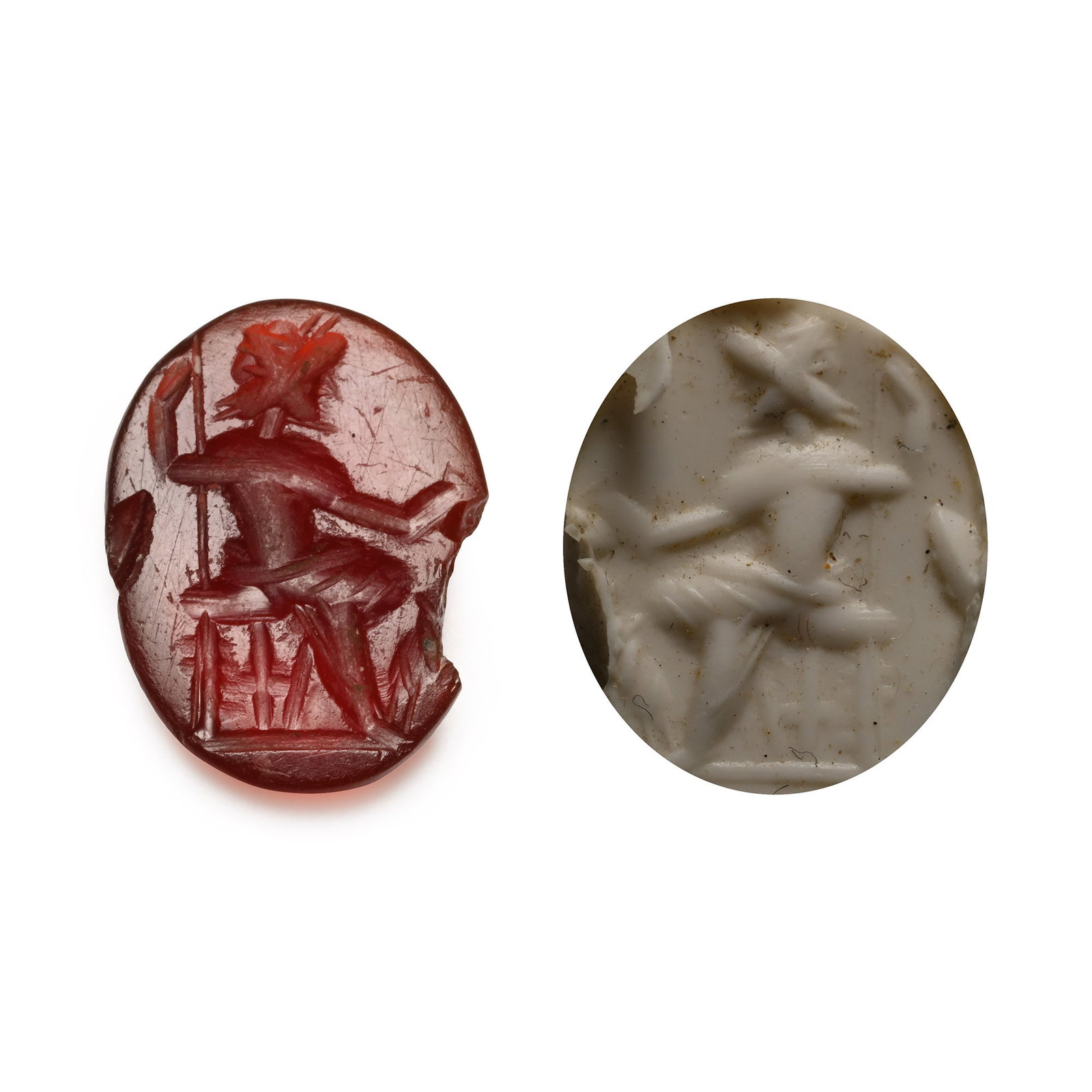 Roman Carnelian Gemstone with Jupiter: 2nd-3rd century A.D. With intaglio seated Jupiter on a throne with a sceptre in his hand; supplied with a museum-quality impression. 0.56 grams, 12.88 mm (1/2 in.). [No Reserve] From the private colle