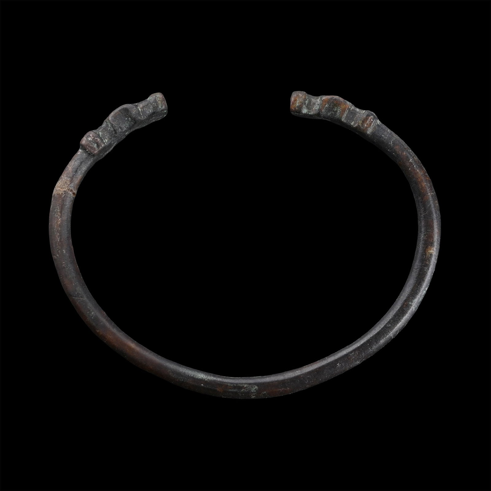 Roman Bronze Bracelet with Animal Heads: Circa 3rd-4th century A.D. Round-section penannular body with stylised beast-head terminals. 14.72 grams, 65 mm (2 1/2 in.). [No Reserve] Ex German art market, 2000s. Acquired from an EU collector liv