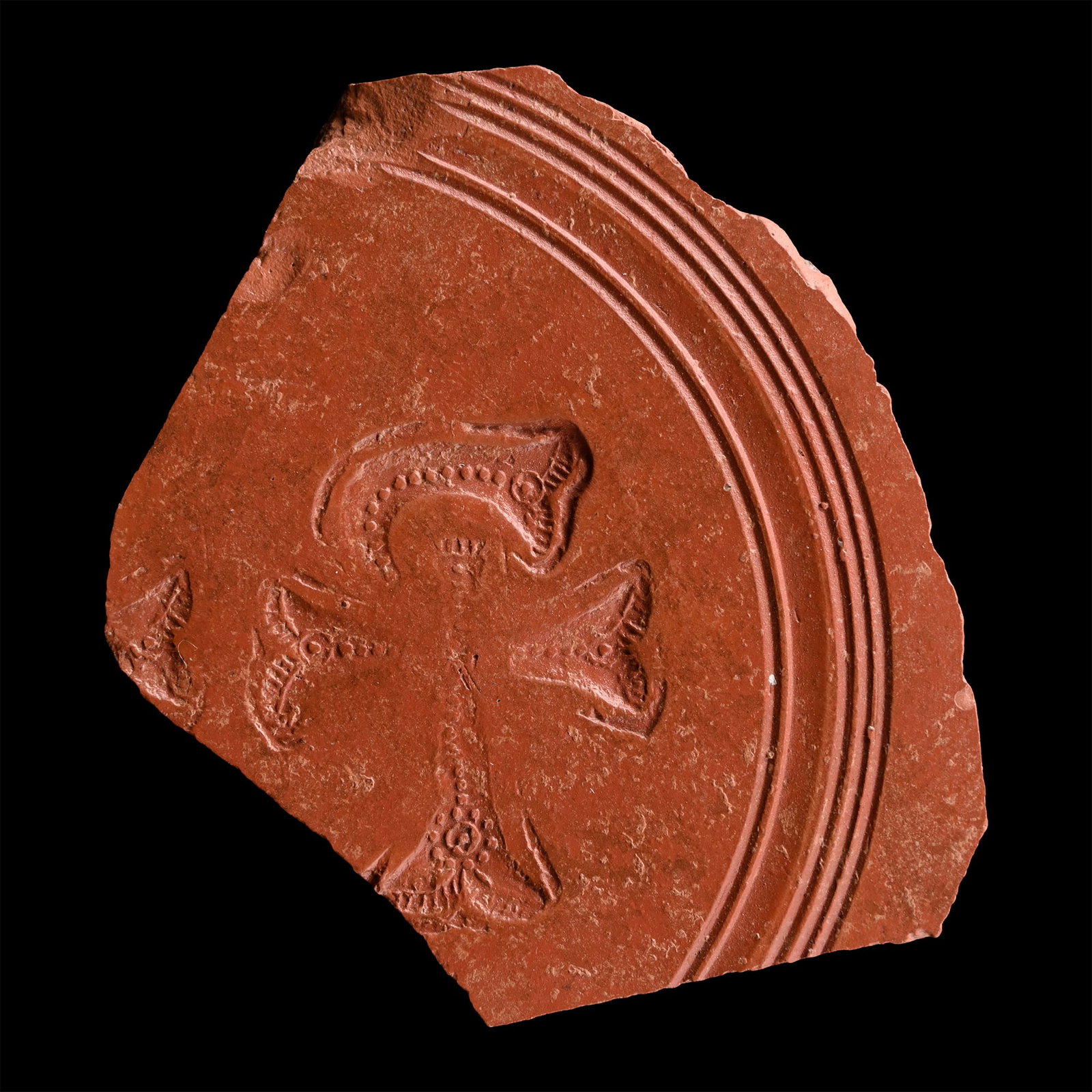 Roman Redware Plate Fragment with Chi Rho: 4th century A.D. An irregular fragment showing concentric banding and a stylised Christogram motif. 49 grams, 83 mm (3 1/4 in.). [No Reserve] Acquired on the UK art market from the 1990s. From the pri