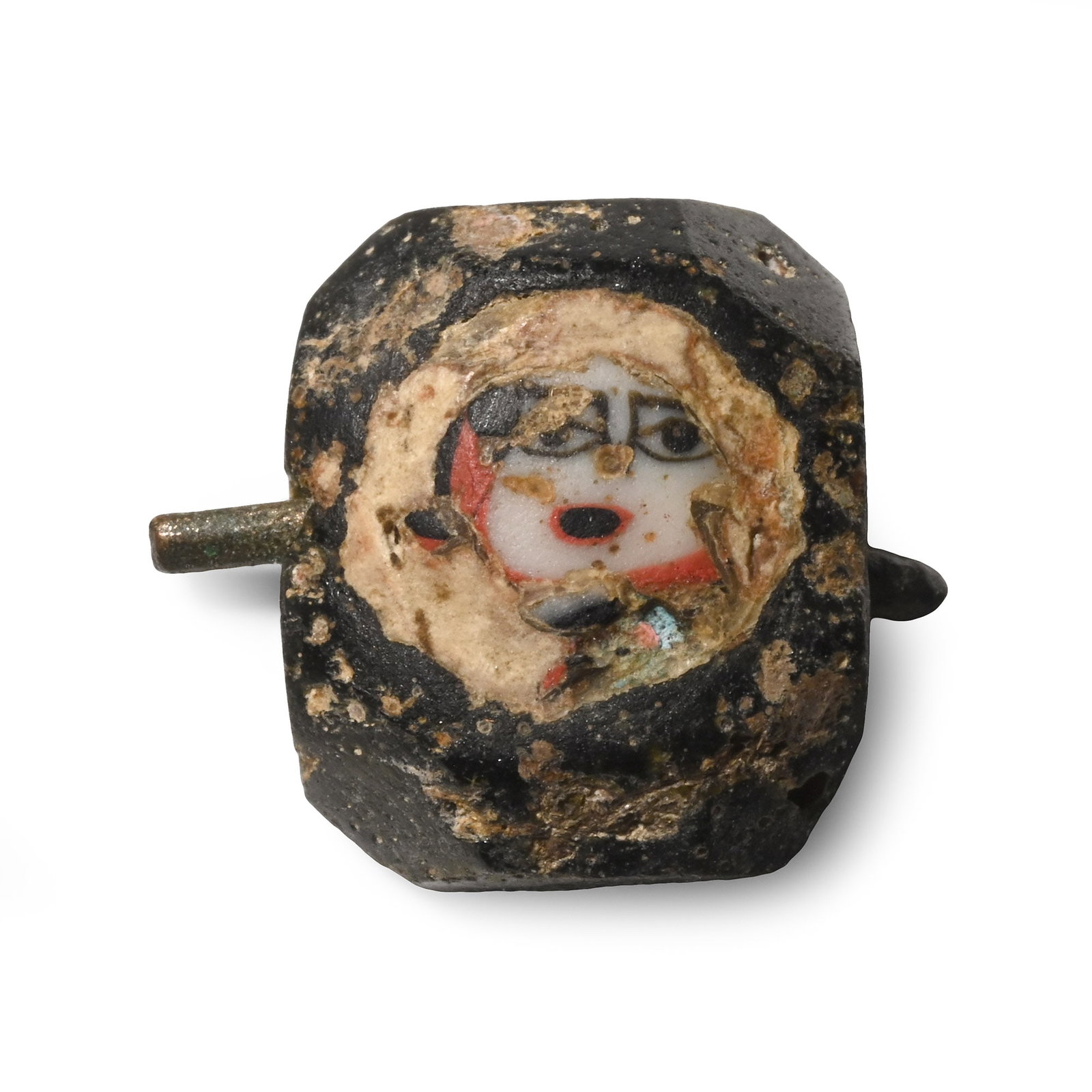 Roman Glass Face Bead: 1st-4th century A.D. Hemispherical polychrome millefiori glass bead with a face motif on a light background. 1.15 grams, 13.75 mm (1/2 in.). [No Reserve] From the private collection of a European gent
