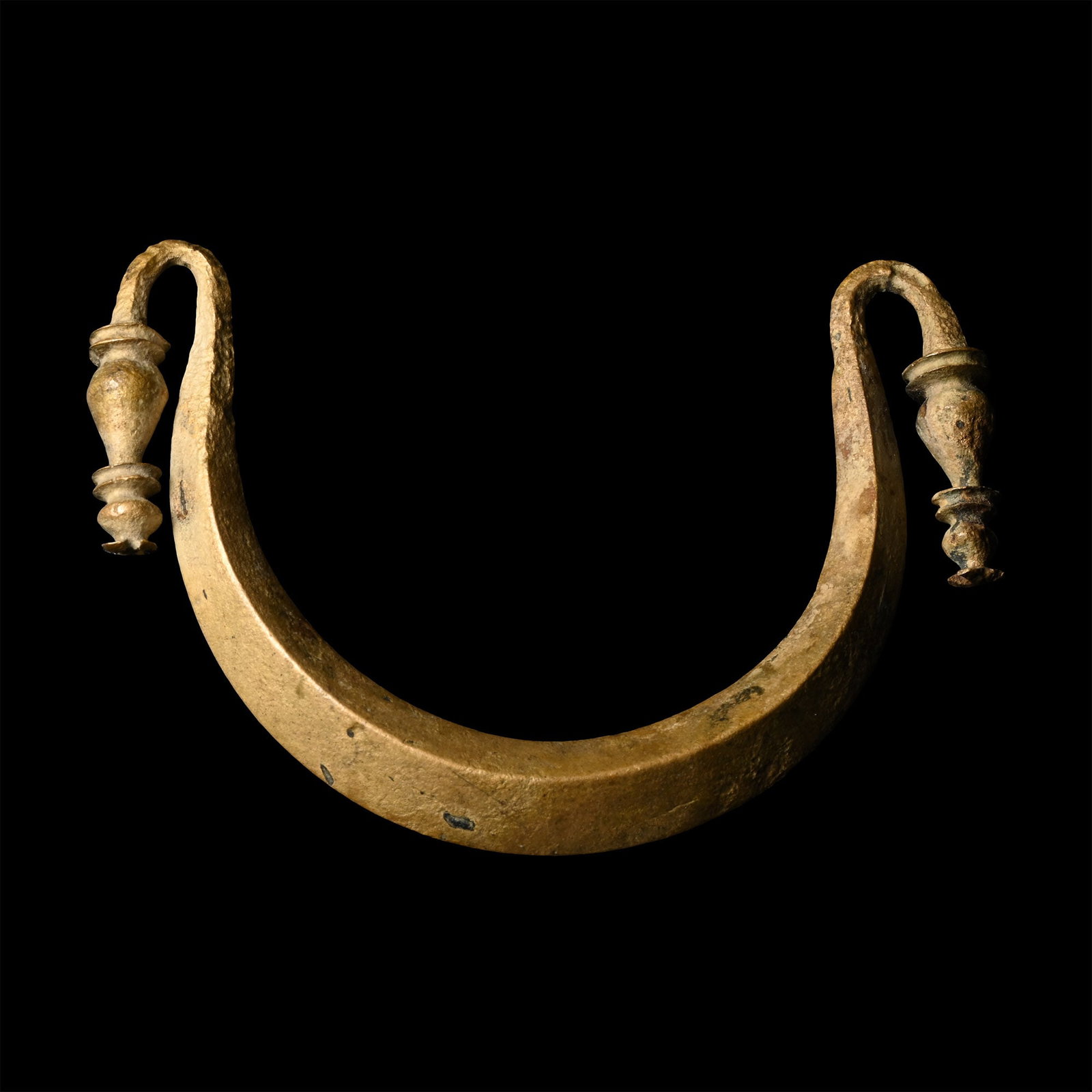 Roman Bronze Vessel Handle: 1st-2nd century A.D. Crescentic in form and square in section with recurved knop finials. 24.25 grams, 63.11 mm (2 1/2 in.). [No Reserve] From the private collection of a European gentleman (1942-2024