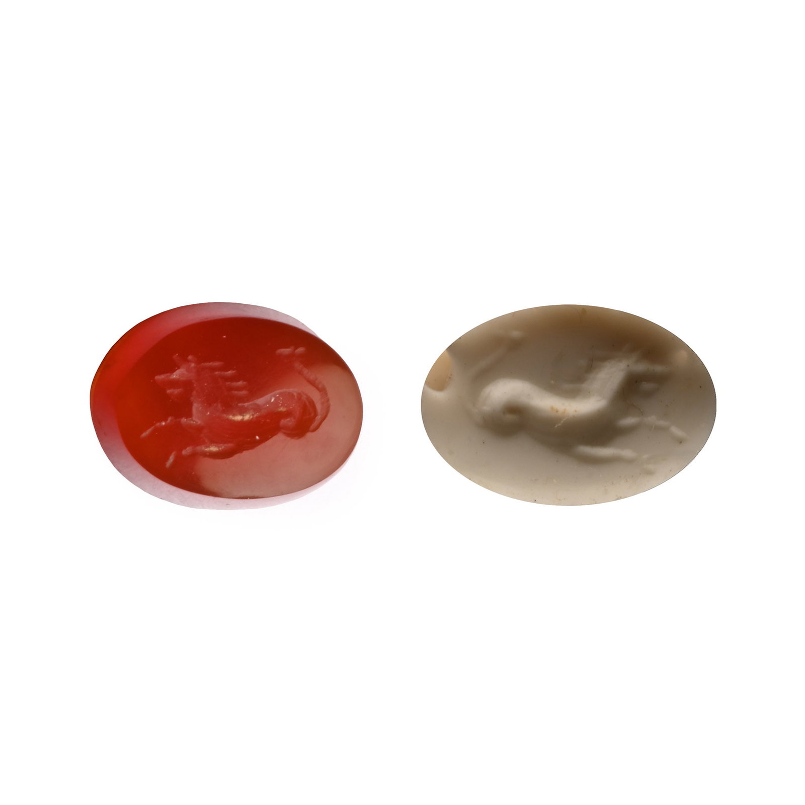 Roman Carnelian Gemstone with Seahorse: 2nd-3rd century A.D. With intaglio seahorse with its forelegs extended; supplied with a museum-quality impression. 0.27 grams, 8.14 mm (1/4 in.). [No Reserve] From the private collection of a European
