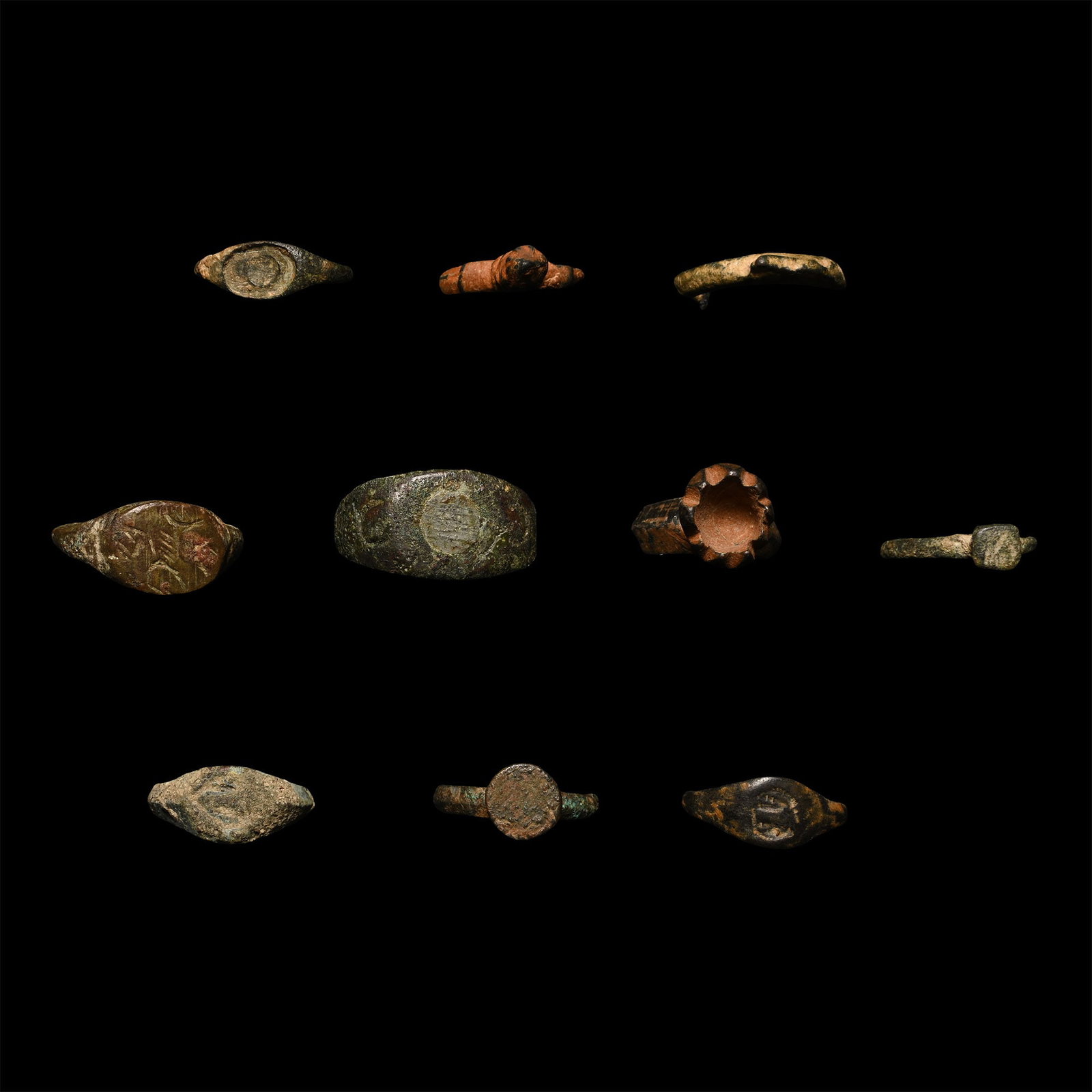 Roman to Byzantine Bronze Ring Group: 2nd-8th century A.D. Comprising nine rings with bezels, one possibly representing a coiled snake. 25.58 grams total, 16-27 mm (5/8 - 1 in.). [10, No Reserve] Bonhams, Knightsbridge, London, Antiquitie