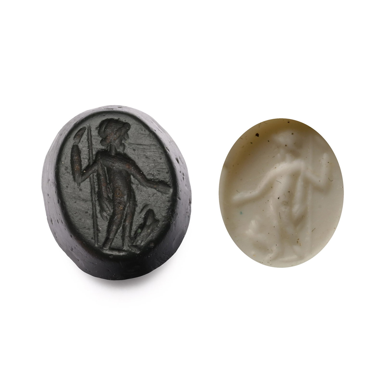 Roman Black Gemstone with Jupiter: 2nd-3rd century A.D. With intaglio Jupiter holding his sceptre, eagle by his feet; supplied with a museum-quality impression. 0.52 grams, 10.61 mm (3/8 in.). [No Reserve] From the private collection o