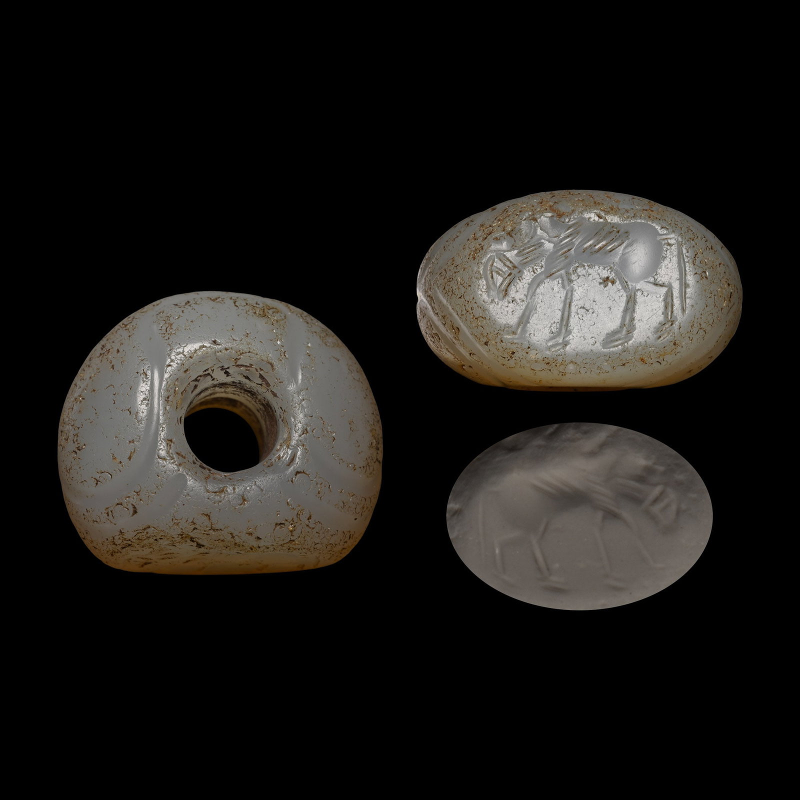 Sasanian Chalcedony Stamp Seal with Animal: Circa 3rd-7th century A.D. With segmented body, incuse quadruped to underside. 13.80 grams, 27.01 mm (1 1/8 in.). [No Reserve] From the private collection of a European gentleman (1942-2024), formed s