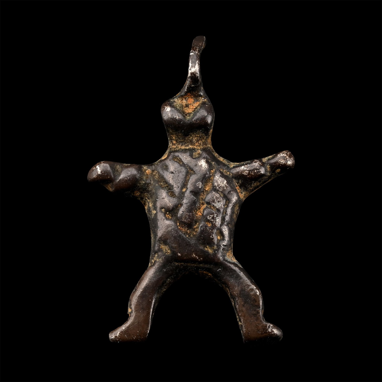 Western Asiatic Silver Amulet: 12th-15th century A.D. Formed as a splayed animal figure with an integral loop. 2.16 grams, 21 mm (7/8 in.). [No Reserve] From the collection of a gentleman, acquired on the London art market in the 1