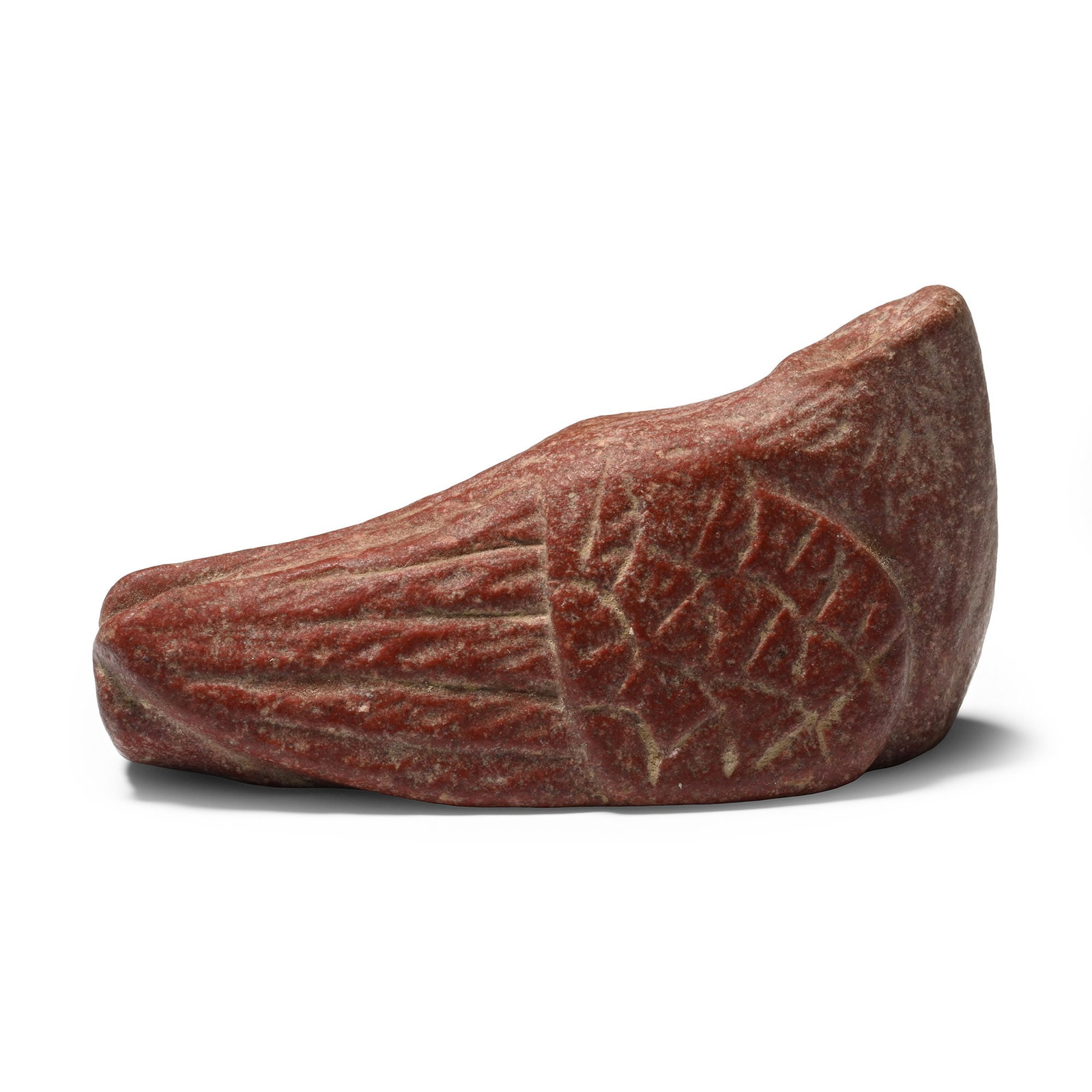 Western Asiatic Red Jasper Body of a Bird: Circa 200 B.C.-100 A.D. Carved in the round in a resting pose with its wings folded against the body, with intricate feather detailing on the body. 37.9 grams, 54.6 mm (2 1/8 in.). [No Reserve] From t