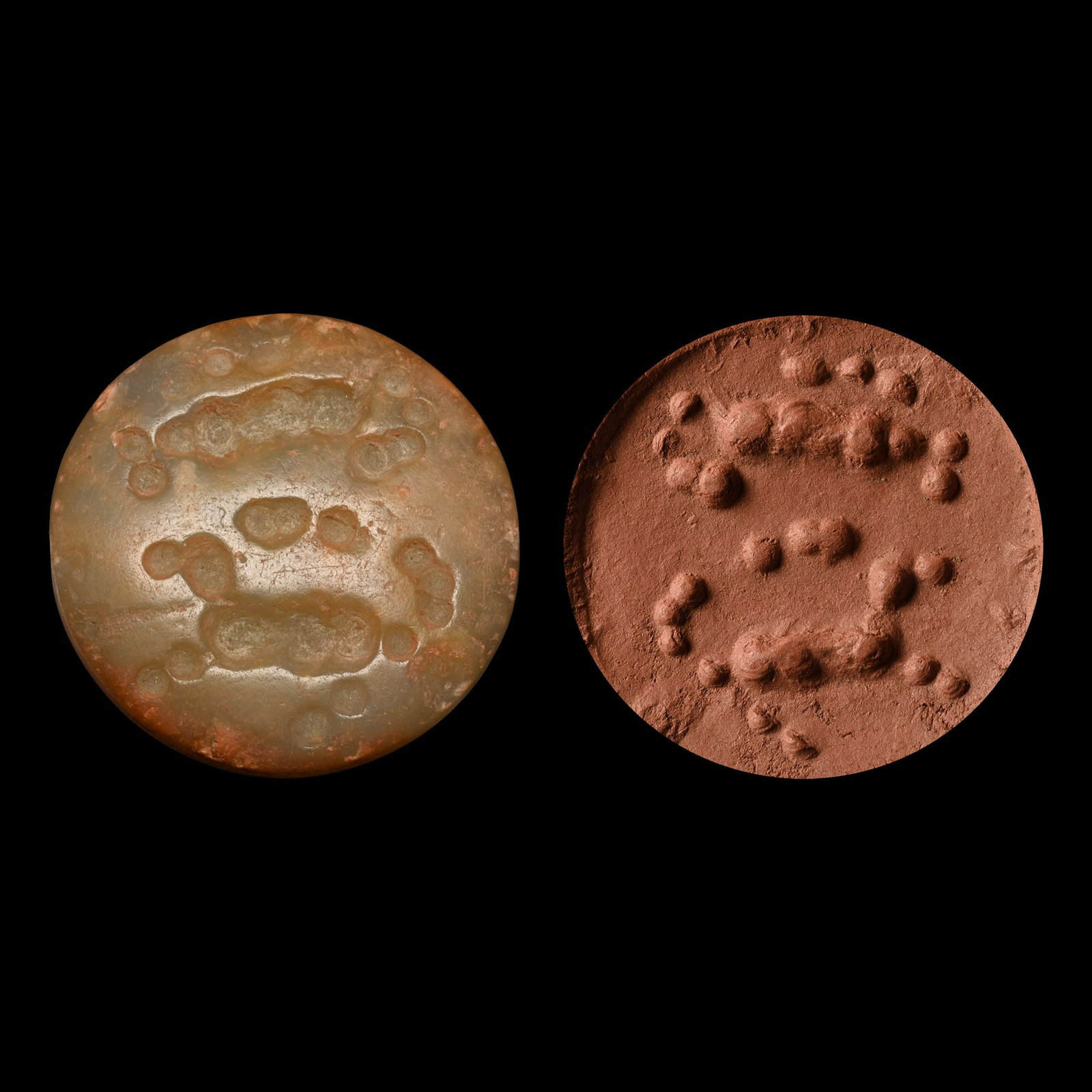 Large Mesopotamian Jemdet Nasr Type Animal Agate Stamp Seal: 31st-29th century B.C. Plano-convex in section with drilled motif to underside of two running quadrupeds; supplied with a museum-quality impression. 36.97 grams, 38.05 mm (1 1/2 in.). [No Reserve] Fro