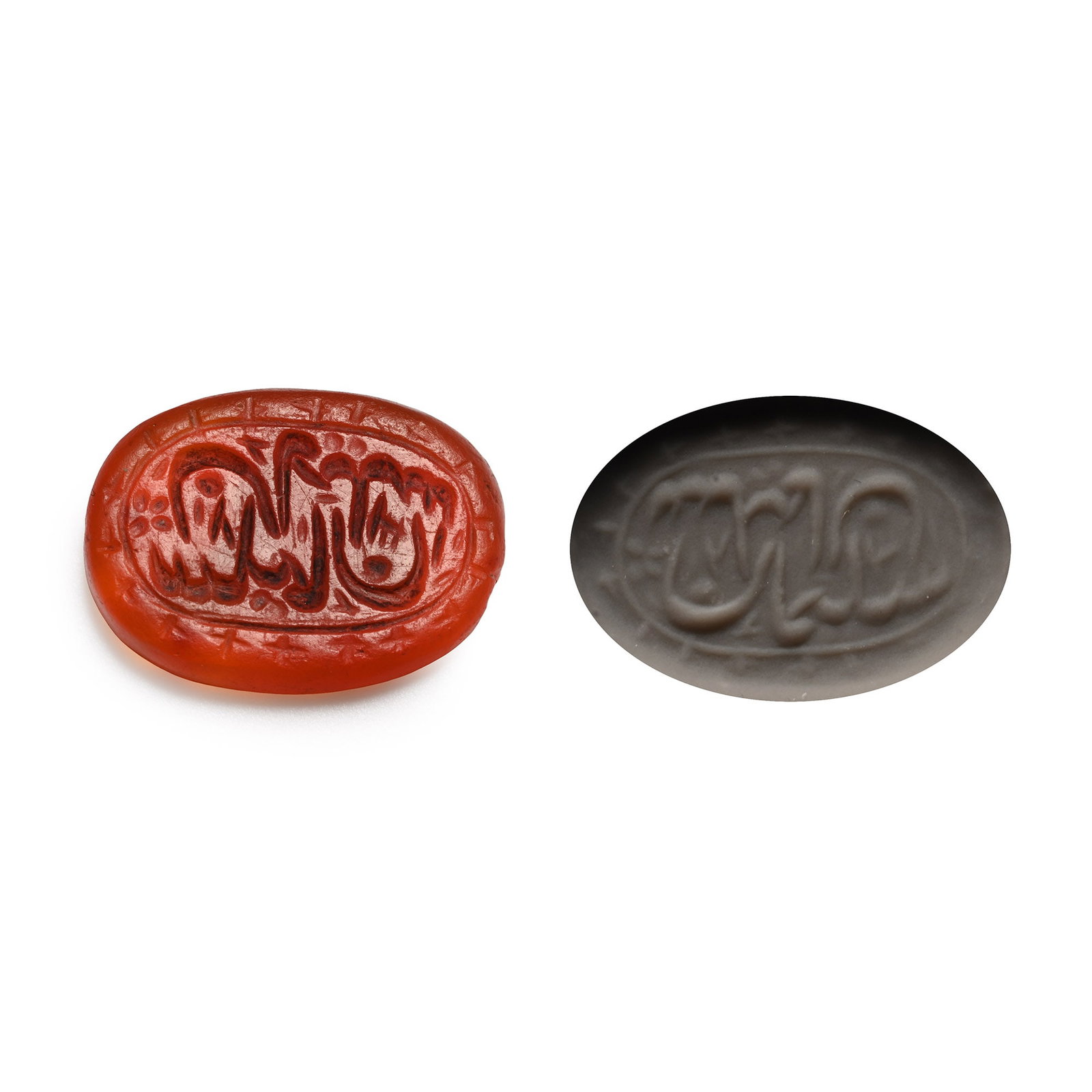 Western Asiatic Engraved Carnelian Calligraphic Intaglio: Late 19th-20th century A.D. An oval intaglio with an inscription framed by a band of star motifs; supplied with a museum-quality impression. 0.64 grams, 13 mm (1/2 in.). [No Reserve] Acquired in the l