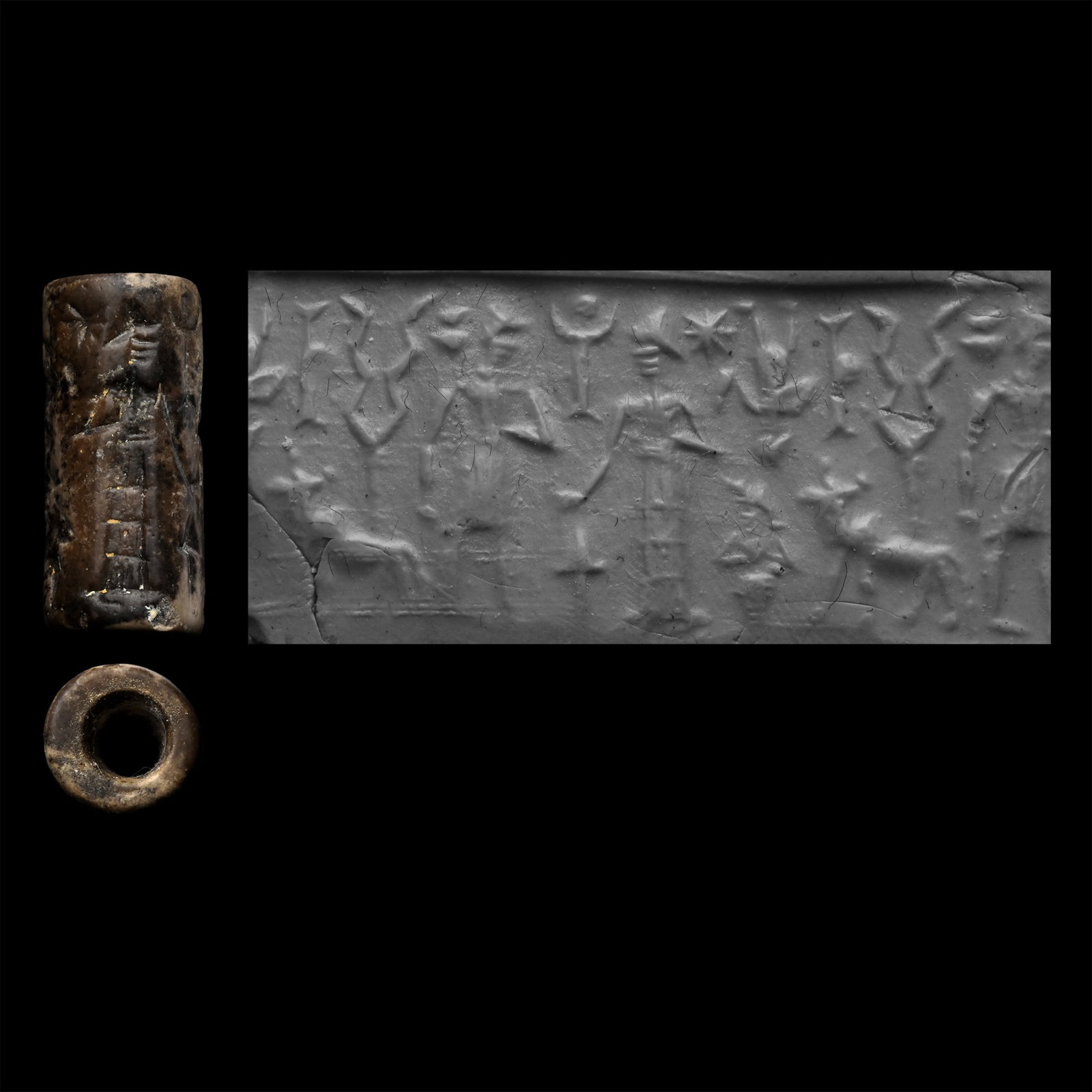 Western Asiatic Grey Stone Cylinder Seal with Figures and Animals: 2nd-1st millennium B.C. Frieze depicting two profile figures standing among birds, scorpions, sunburst and other motifs; supplied with a museum-quality impression. 3.39 grams, 21.79 mm (7/8 in.). [No 