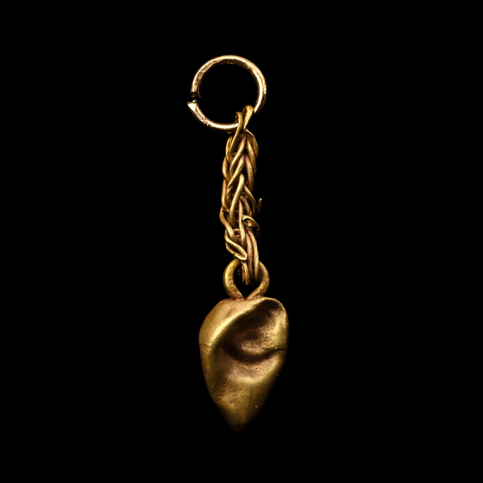 Western Asiatic Gold Teardrop Pendant: 1st millennium B.C. Comprising a hollow-form teardrop-shaped pendant suspended from a chain with a later gold-coloured loop. 0.55 grams, 26 mm (1 in.). [No Reserve] Ex private British collection, form