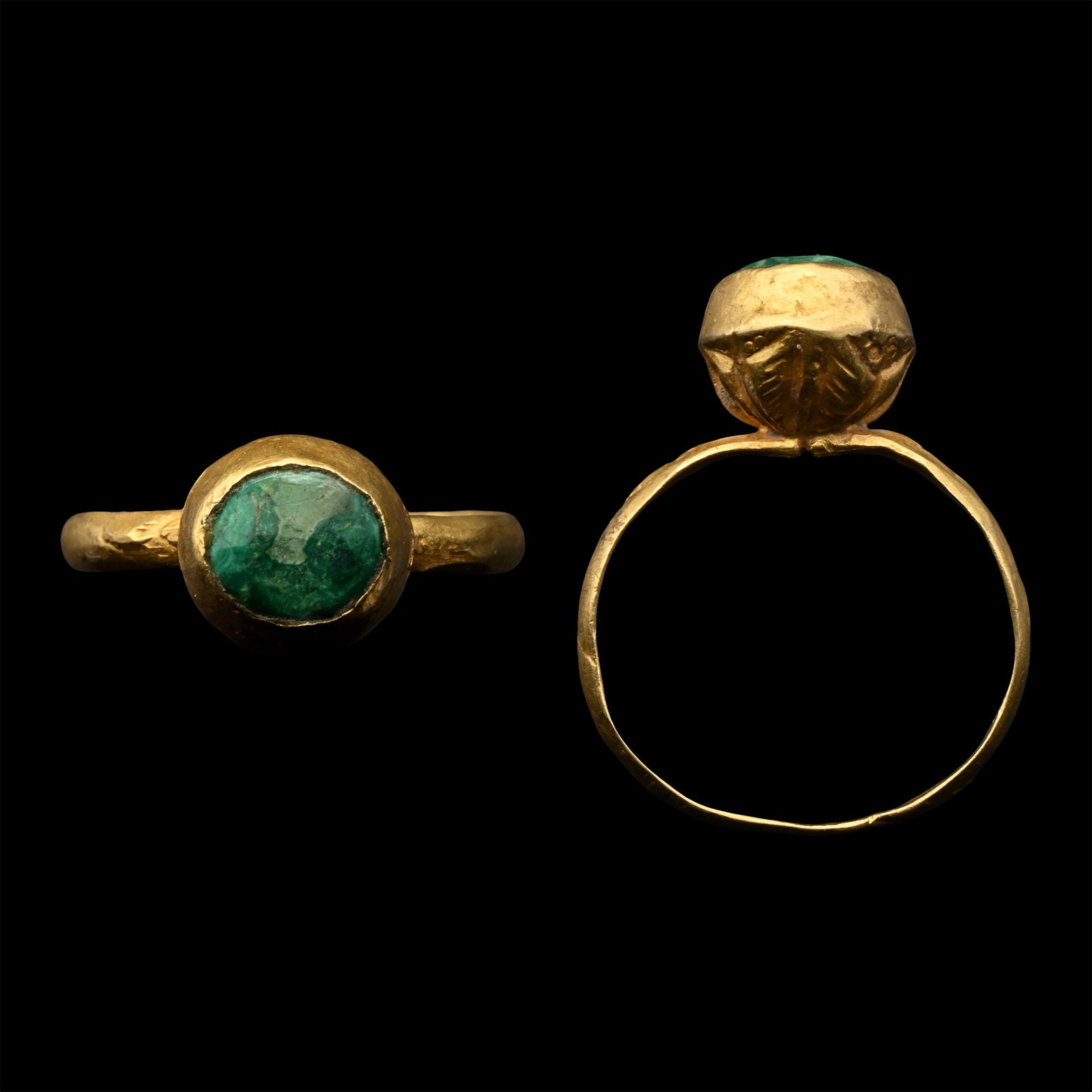 Western Asiatic Ring with Cabochon: Late 19th-20th century A.D. Biconvex bezel with petal detailing to the lower body, inset facetted cabochon. 3.04 grams, 25.80 mm overall, 18.32 x 16.08mm internal diameter (approximate size British O,