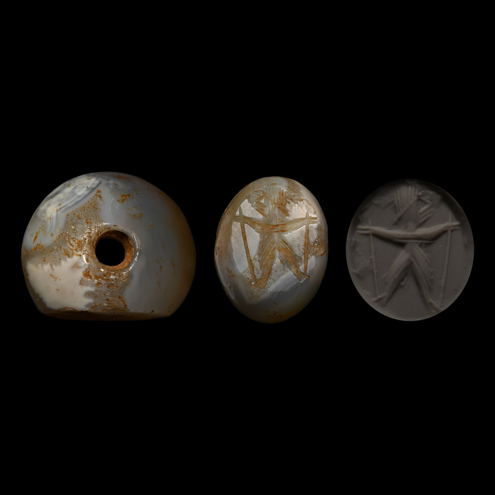 Sasanian Agate Stamp Seal with Man Holding Staves: Circa 3rd-7th century A.D. Annular in profile with incised figure of a man holding two staves. 8.07 grams, 21.03 mm (7/8 in.). [No Reserve] From the private collection of a European gentleman (1942-20