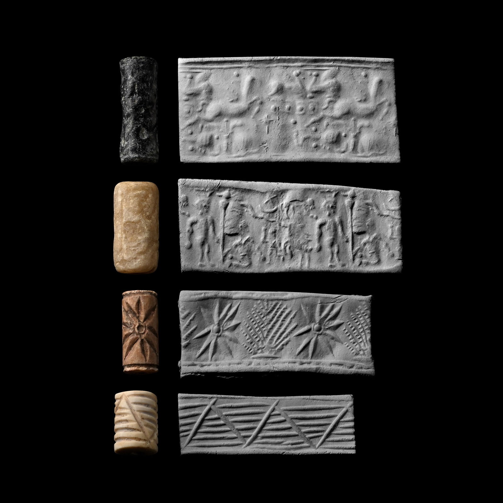 Western Asiatic Stone Cylinder Seal Group: 2nd-1st millennium B.C. Comprising: hero with spear flanked by animals; gryphon fleeing with objects in the field; zigzag on a barred field; starburst and plant motifs; each supplied with a museum-qua