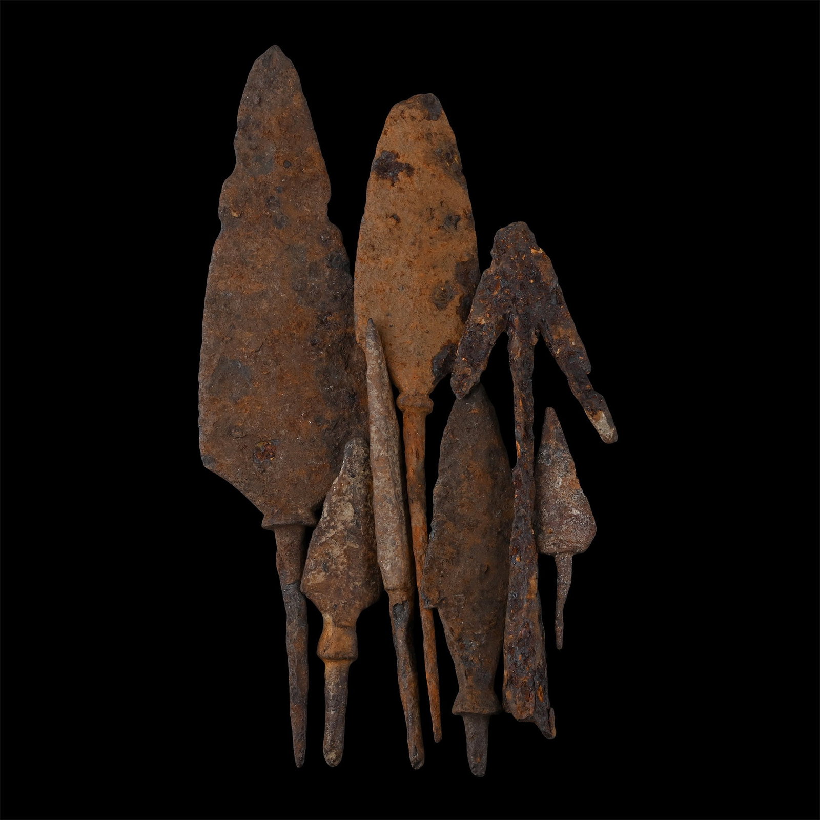 Roman to Medieval Iron Arrowhead Collection: 3rd-14th century A.D. Comprising seven tanged arrowheads, one a swallowtail type. 86 grams total, 5.7-13 cm (2 1/4 - 5 1/8 in.). [7] Ex German art market, 2000s. Acquired from an EU collector living i