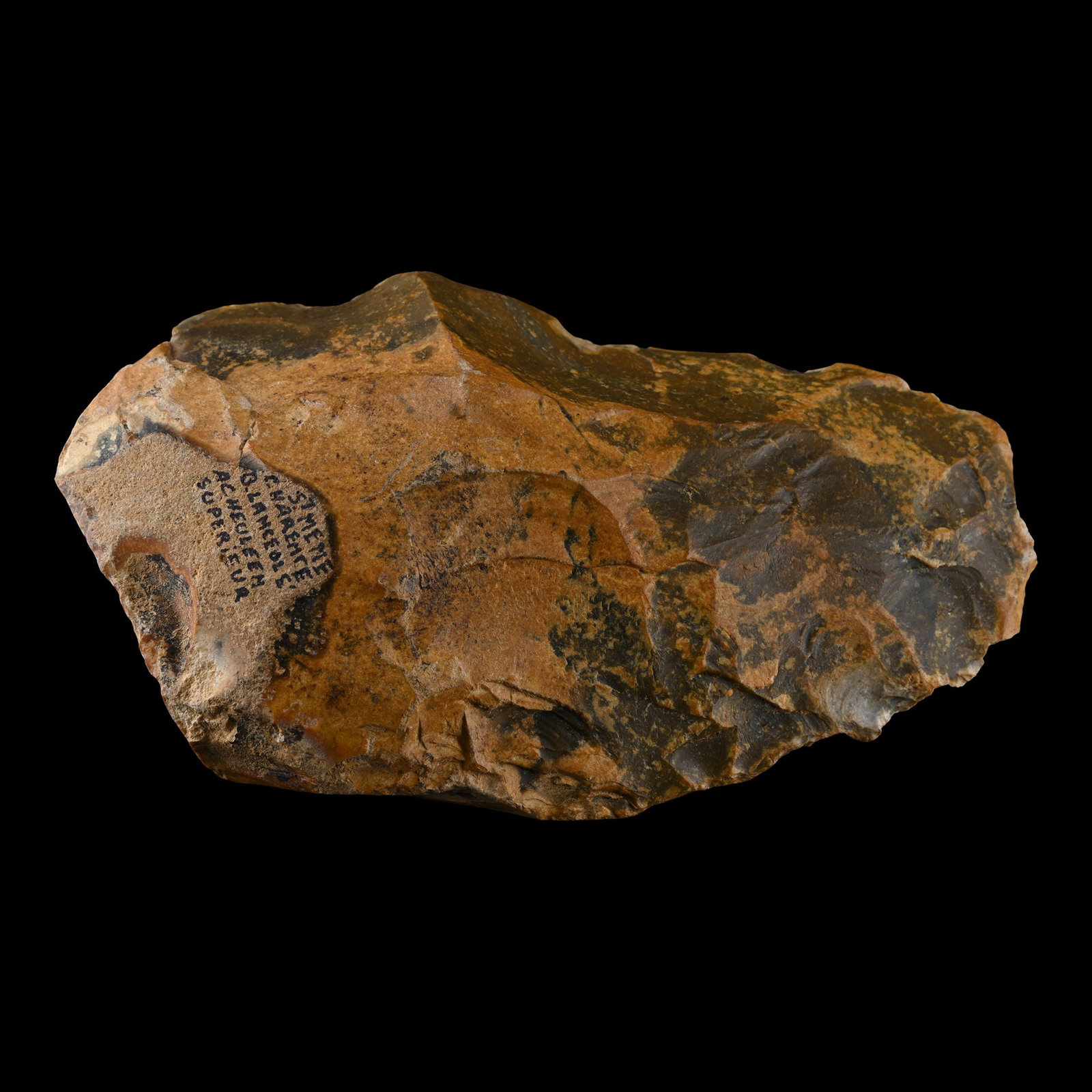 Large Stone Age Acheulean Knapped Flint Handaxe with Attractive Orange Patina: Late Lower Palaeolithic Period, circa 300,000-200,000 ?.P. Cordate in plan with rounded edge; marked at the base 'St. Meme Charente B. Lanceols' Achuleen Superieur'. 629 grams, 14.8 cm (5 3/4 in.). [N