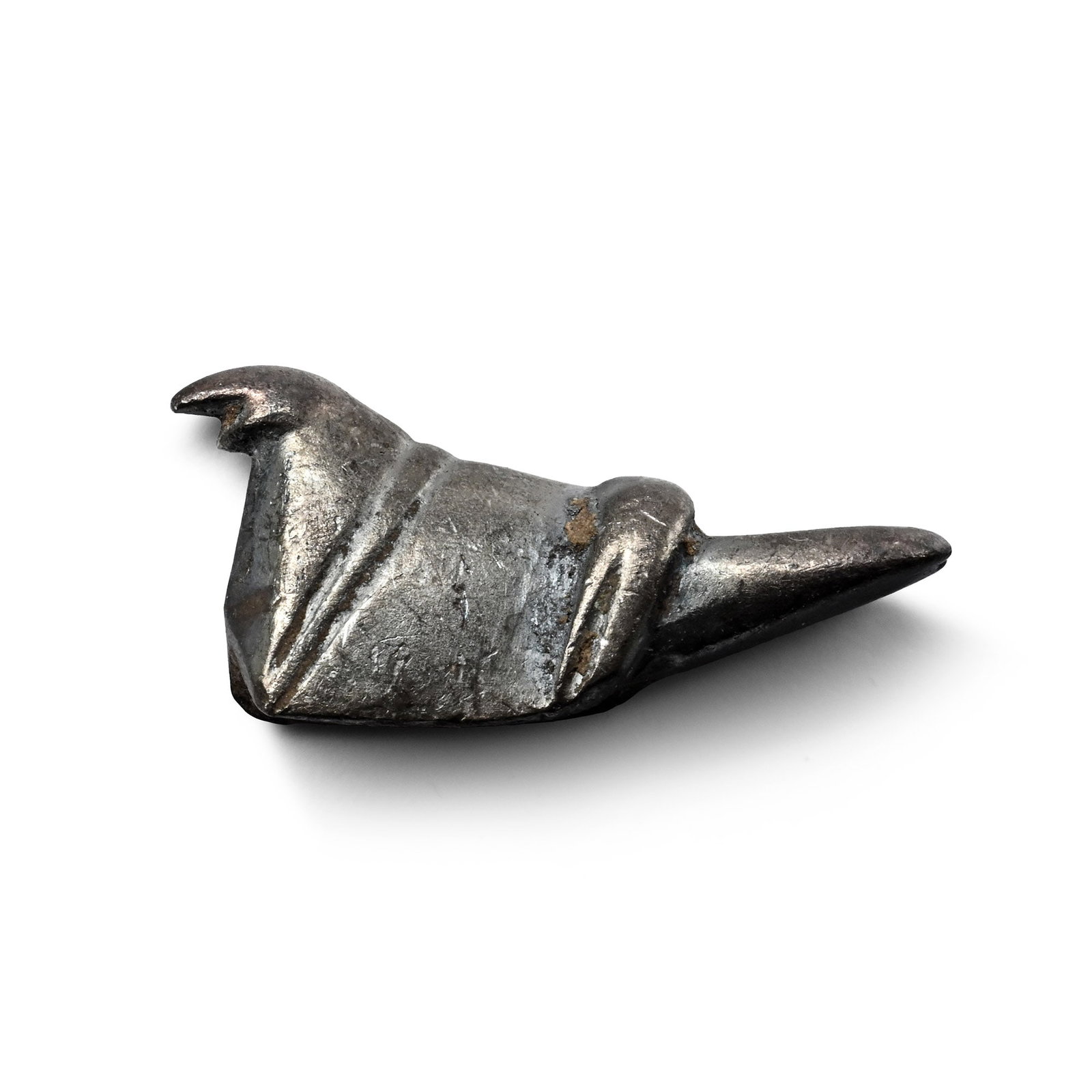 Celtic Silver Duck Mount: Iron Age, 2nd century B.C.-1st century A.D. With a saddle-shaped body, hatched bands, small head with a pointed beak, concave to the underside. 2.06 grams, 17.6 mm (5/8 in.). [No Reserve] From the pri