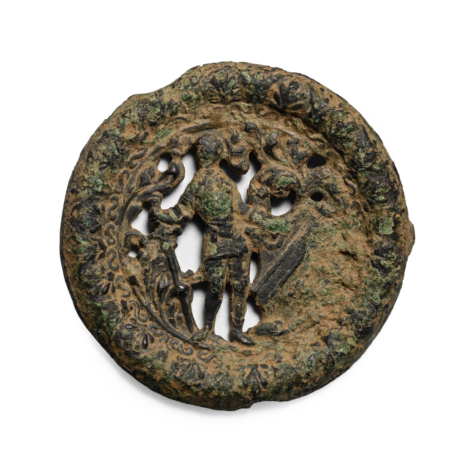 Medieval Bronze Man with Broadsword and Shield Pilgrim's Badge: Circa 14th-15th century A.D. Wreath border surrounding an openwork scene with an armoured figure standing, sword in his right hand, supporting a heater shield and helmet with plume. 3.20 grams, 26 mm 