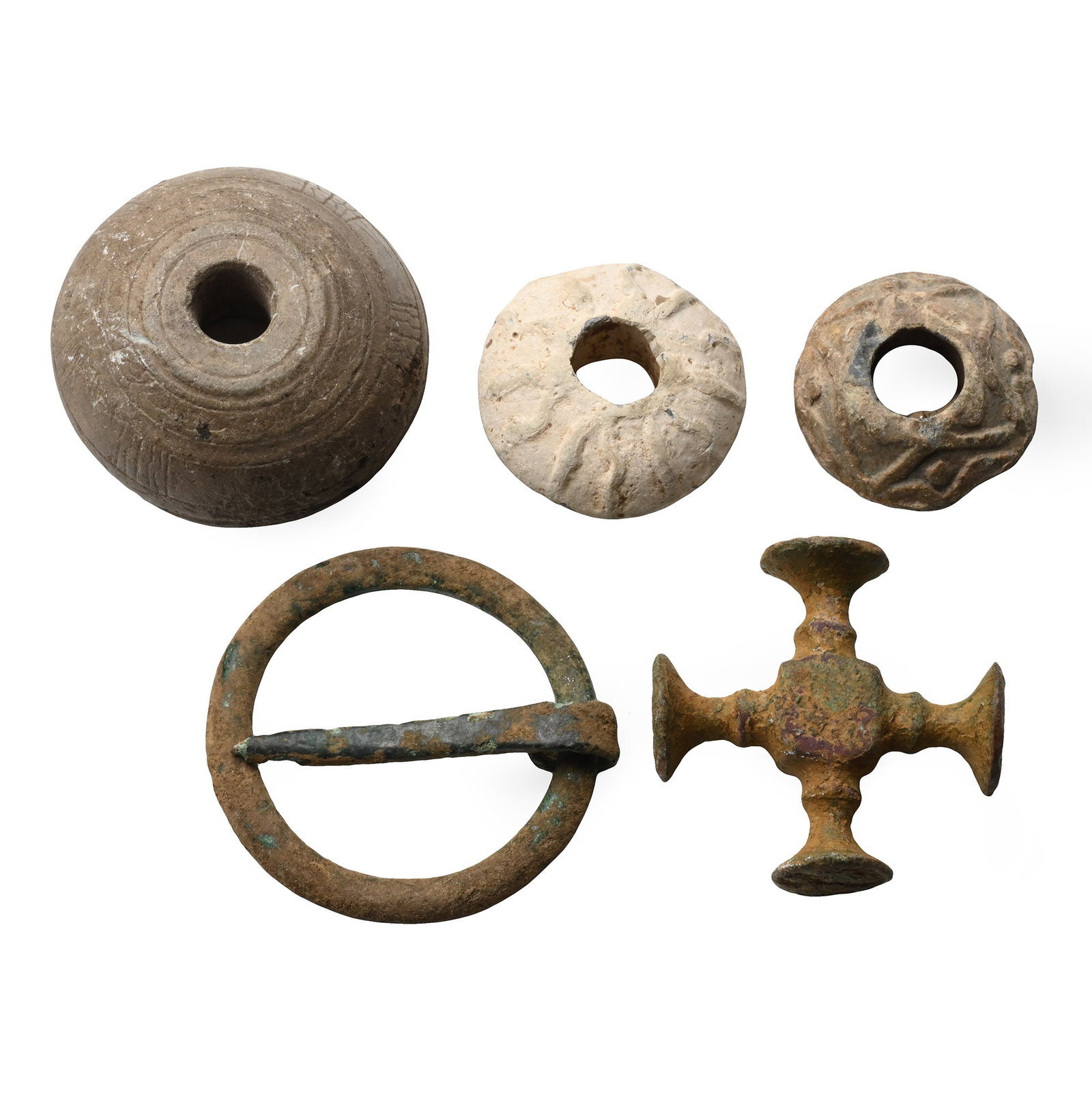 Anglo-Saxon, Medieval and Stuart Period Artefact Group: 7th-17th century A.D. Including: a plano-convex Anglo-Saxon stone spindle whorl; an annular brooch; a four-headed seal, and other items. 160 grams total, 26-44 mm (1 - 1 3/4 in.). [5, No Reserve] Foun