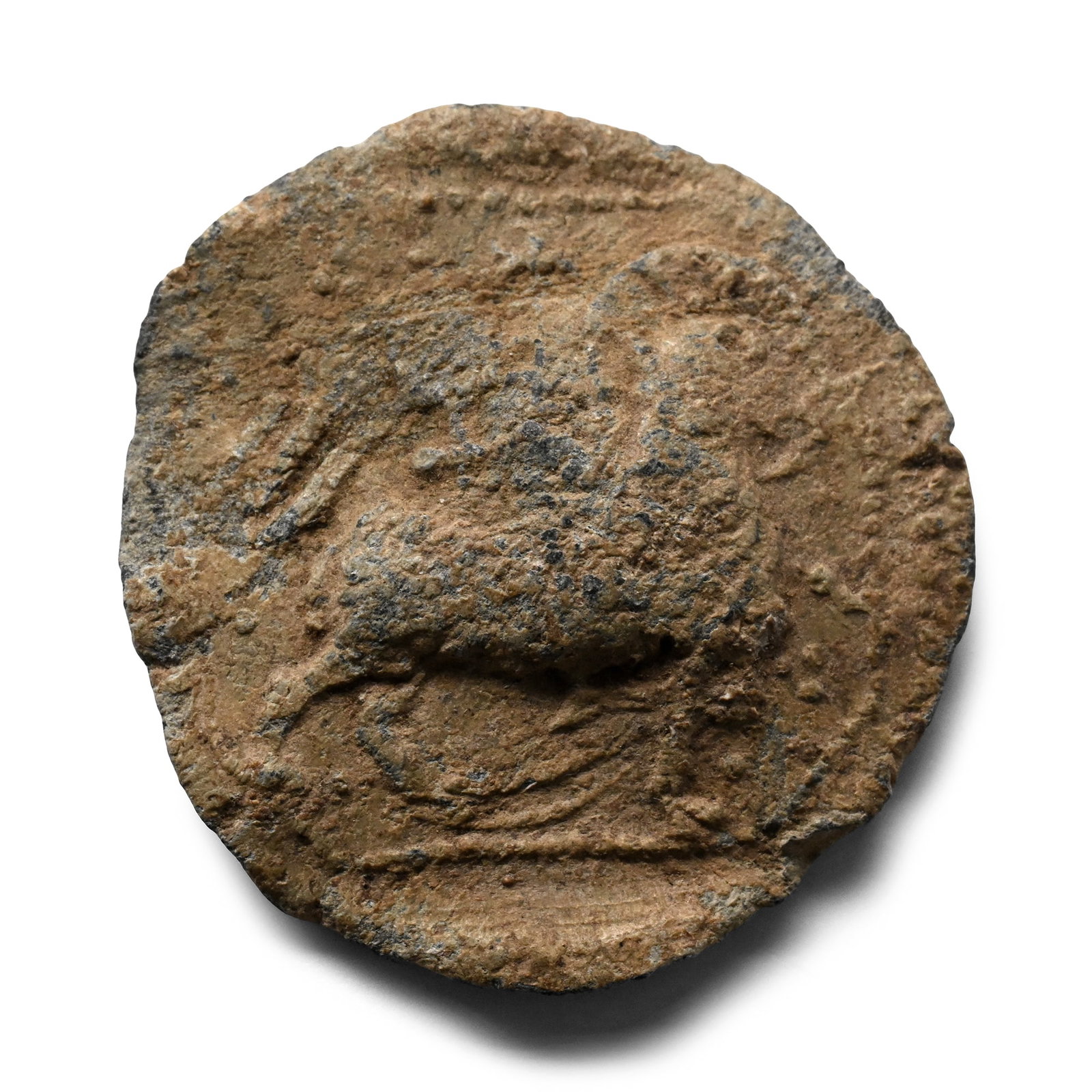 Medieval Pewter Badge with Agnus Dei: 14th-15th century A.D. Discoid in plan with beaded border to a rectangular field, low-relief Agnus Dei advancing with nimbus to the animal's head, outer end of banner behind its rump; cross and pellet