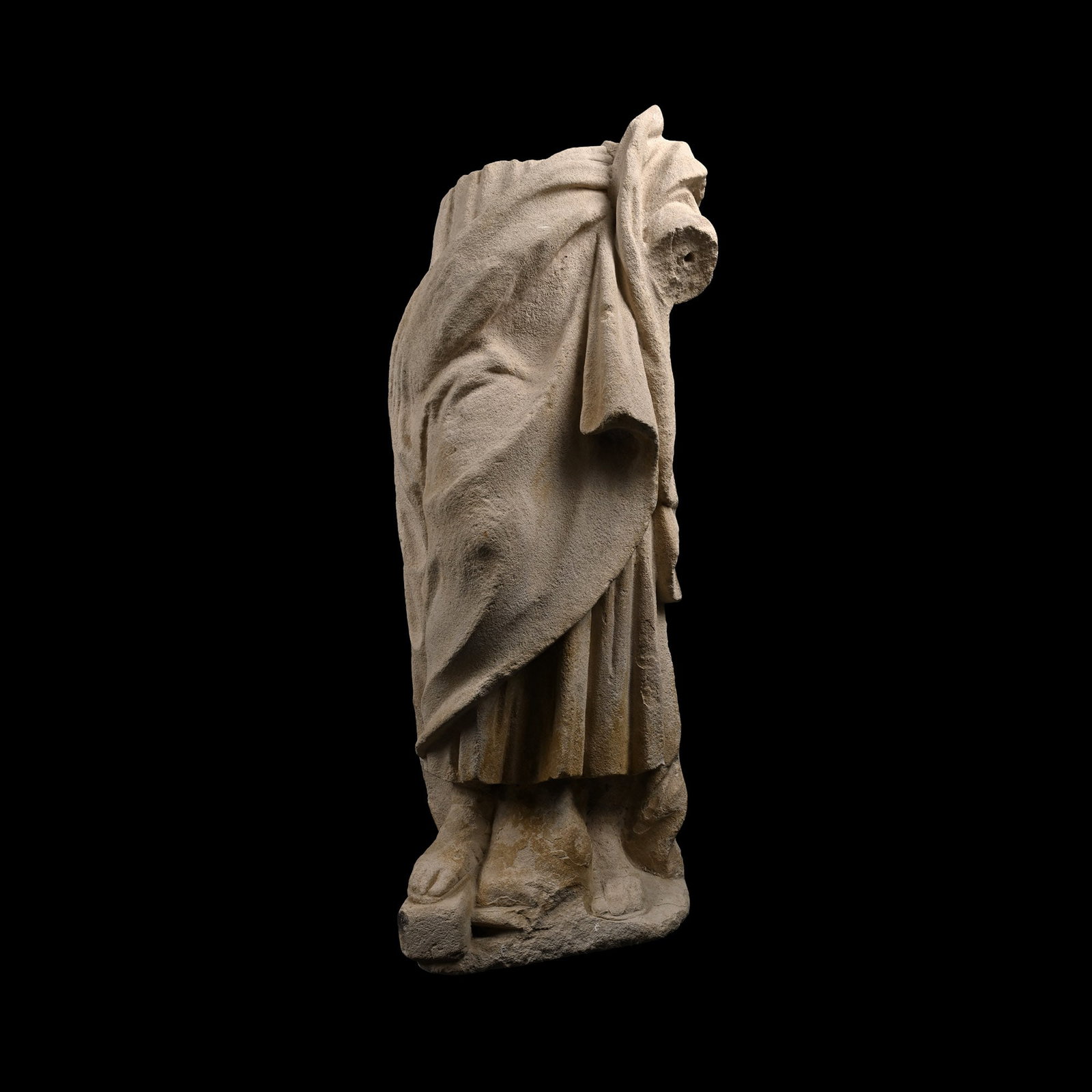 Large Renaissance Stone Statue of Standing Male: Northern Italy, 16th-17th century A.D. Modelled in the round wearing a long tunic and a palla draped over his left shoulder, leather sandals with straps on his exposed feet. Cf. Antista, G., La chiesa