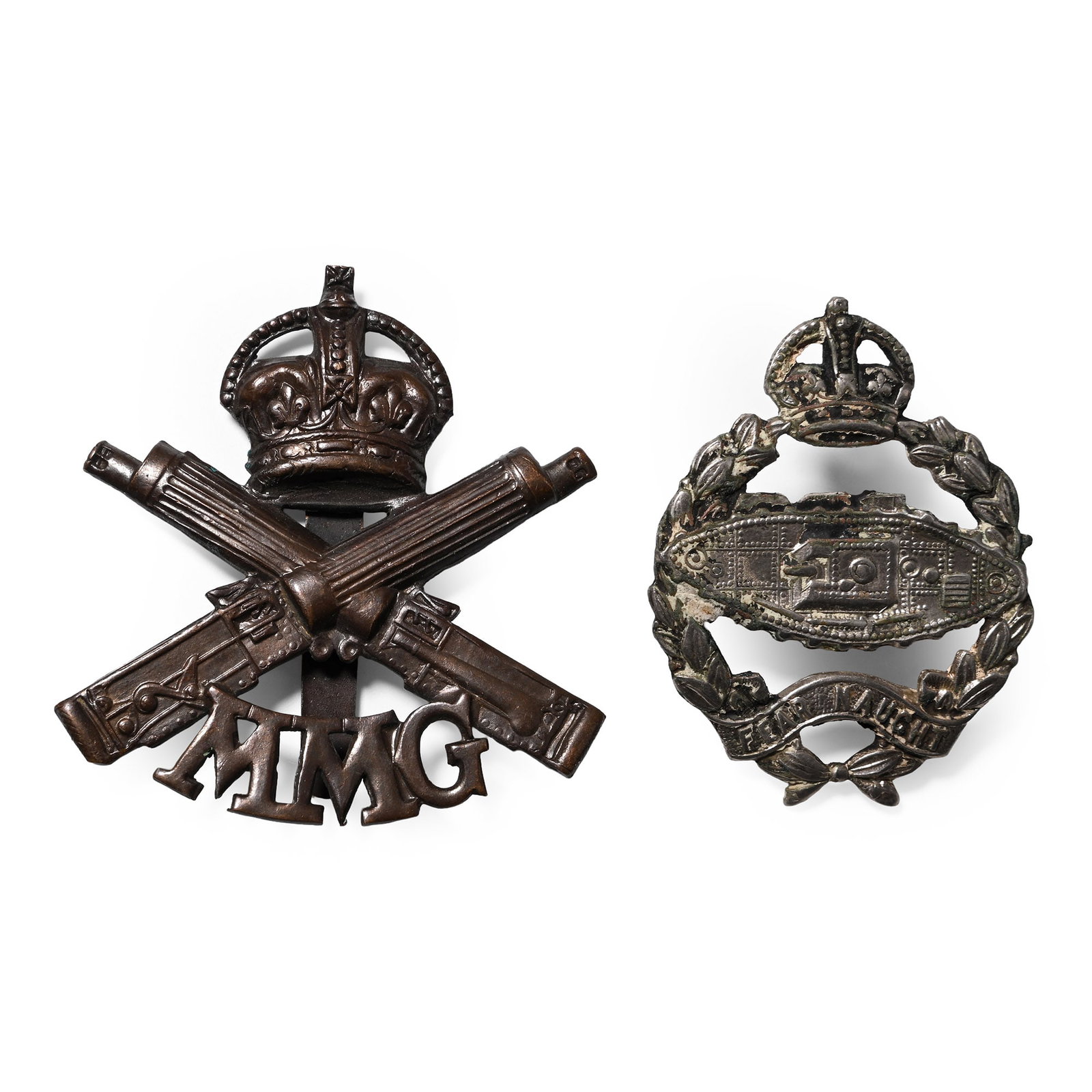 WWI Hat Badge Collection: 1914-1918 A.D. Comprising: Royal Tank Regiment cap badge; Motor Machine Gun cap badge. 22.7 grams total, 49-55 mm (1 7/8 - 2 1/8 in.). [2, No Reserve] Acquired on the UK art market. Property of an Ess