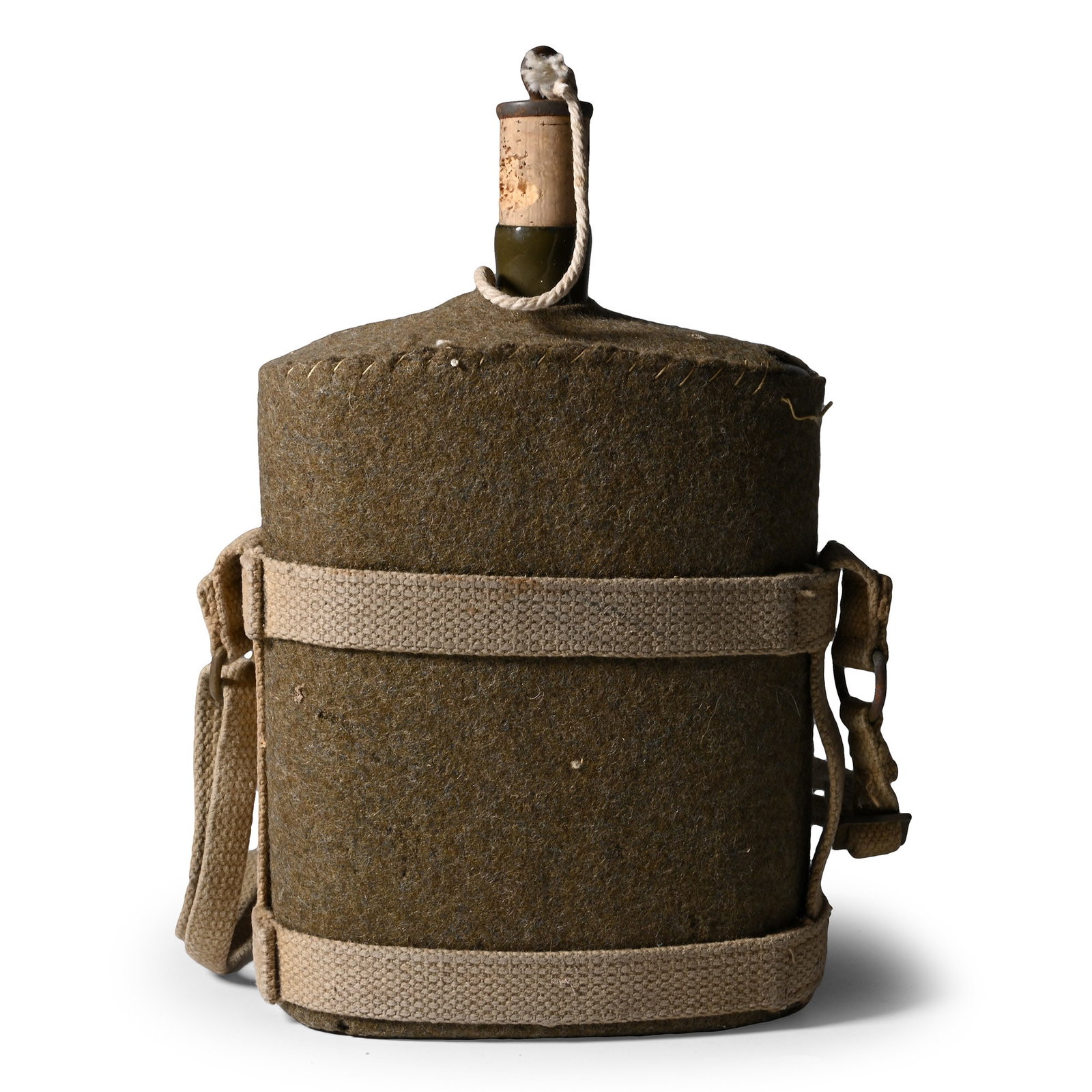 Royal Air Force WWII Water Bottle: 1939-1945 A.D. Green enamel bottle with cork and green serge cover with a cradle. 560 grams, 25 cm high (9 7/8 in.). [No Reserve] Acquired on the UK art market. Property of an Essex militaria collecto