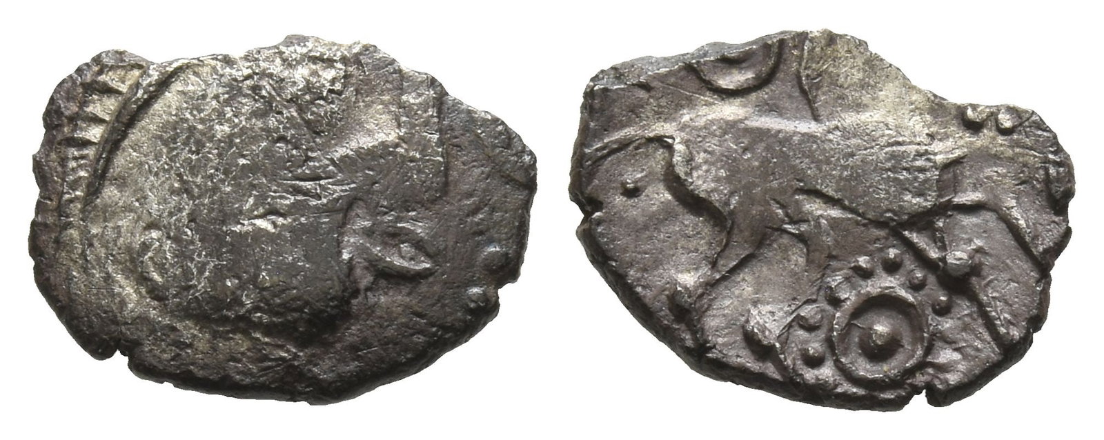 Celtic Britannia. Iceni AR Unit.: Circa 50-15 BC. Odin's Eye type. Uninscribed issue. Male head to right, with herringbone hair and large oval eye; another eye in front of mouth / Horse to right, pellet in annulet in beaded ring below
