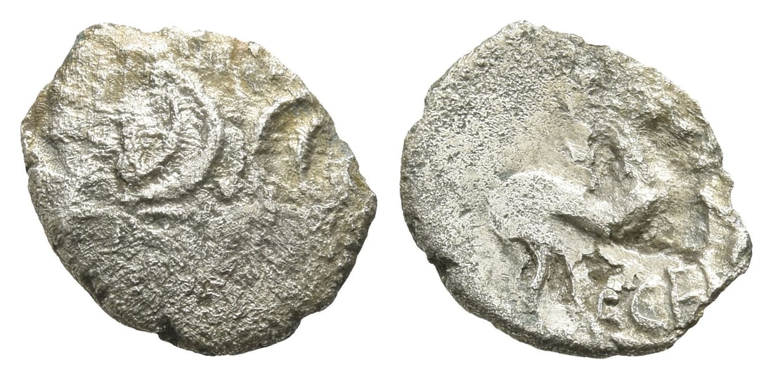 Celtic Britannia. Iceni AR Unit.: Circa AD 10-43. Two opposed crescents with pellets between, superimposed upon band of three lines / Horse to right, ECE below. Cf. Van Arsdell 764; SCBC 445. 0.57gr, 13mm, 10h. Acquired on the UK art 
