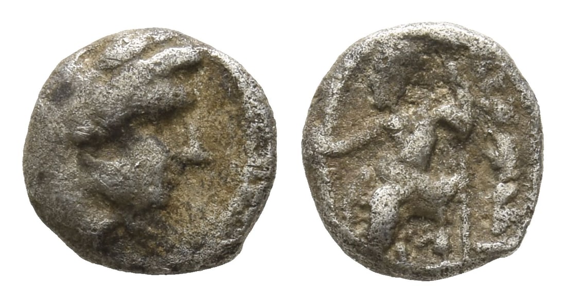 Kingdom of Macedon, Alexander III AR Obol.: 336-323 BC. Uncertain mint. Head of Herakles to right, wearing lion skin headdress / A?E?AN?POY, Zeus Aëtophoros seated to left, holding sceptre; uncertain controls. Cf. HGC 3.1, 918. 0.64gr, 9mm, 3h