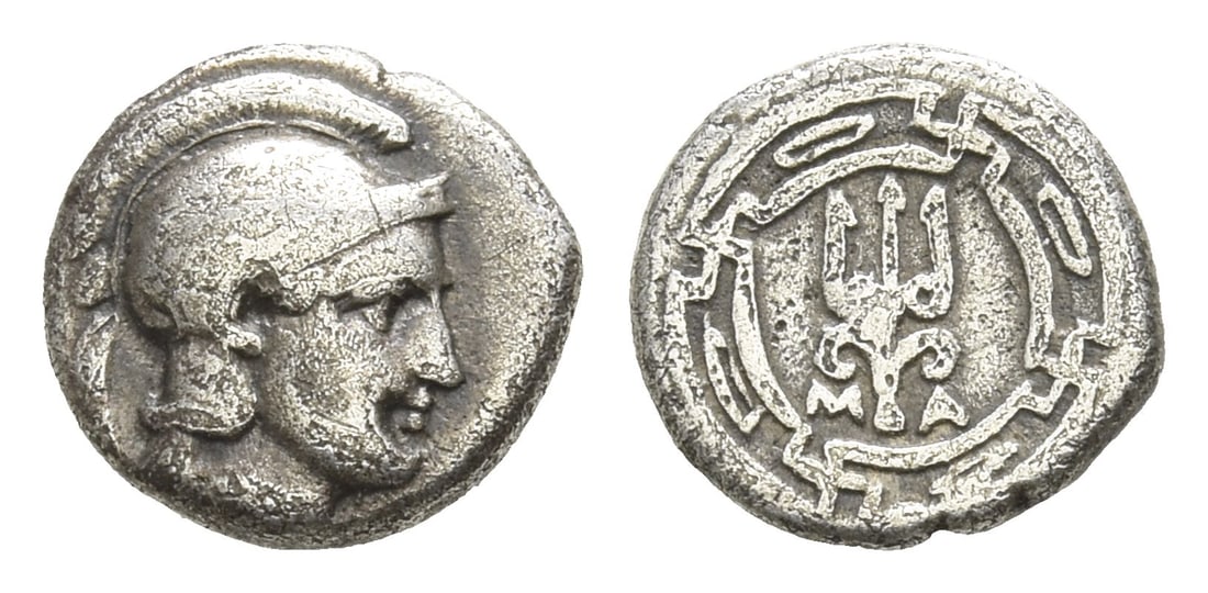 Ionia, Magnesia ad Maeandrum AR Obol.: Circa 350-325 BC. Head of Athena to right, wearing crested Attic helmet / M-A, trident; all within maeander circle. SNG Copenhagen 810; SNG von Aulock 2032 (helmet also wreathed). 0.76gr, 9mm, 6h. Fro