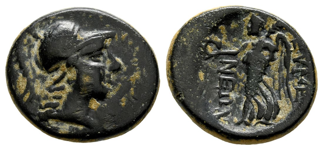 Phrygia, Eumeneia AE 22mm.: Circa after 133 BC. Uncertain magistrate. Helmeted head of Athena to right / EYME-NE?N, Nike advancing to left, holding wreath and palm branch. Cf. BMC 7-8 (Diophan-, magistrate). 7.16gr, 22mm, 12h. P