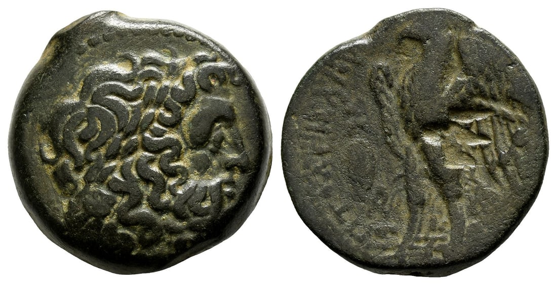 Ptolemaic Kingdom of Egypt, Ptolemy II Philadelphos AE Obol.: Circa 260s BC. Alexandria mint. Laureate head of Zeus to right / ?????????? [????????], eagle with wings spread standing to left on thunderbolt; to left, Galatian shield between two monograms; ? betwe