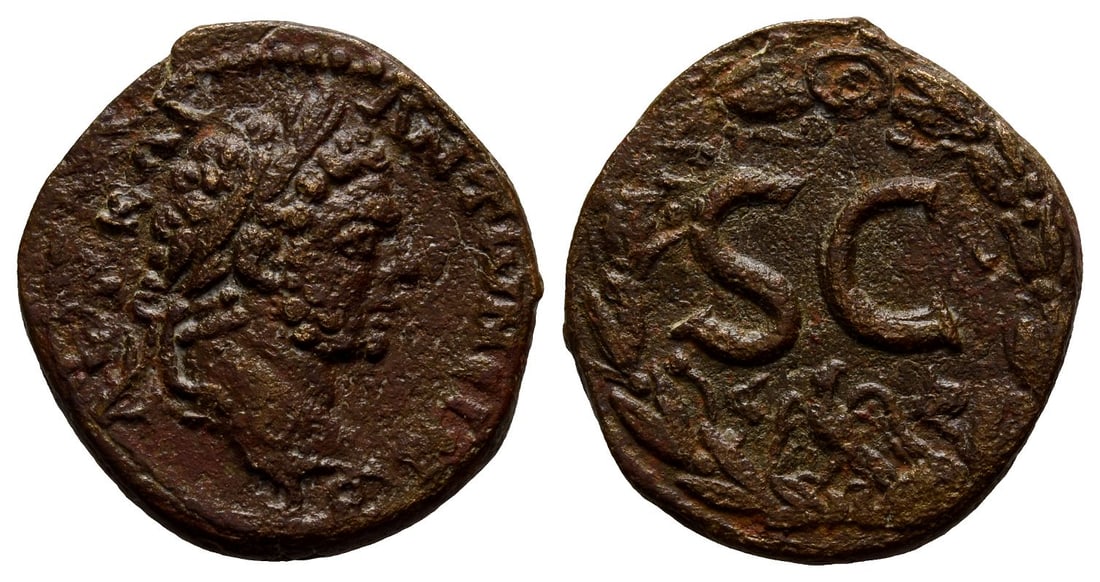 Caracalla AE 24mm of Antioch, Seleucis and Pieria.: AD 198-217. AVT KAI ANT?N?INOC, laureate head to right / Large S C; below, eagle standing slightly to left, head to right, with wings spread; uncertain letter and symbol flanking; all within wreath. C