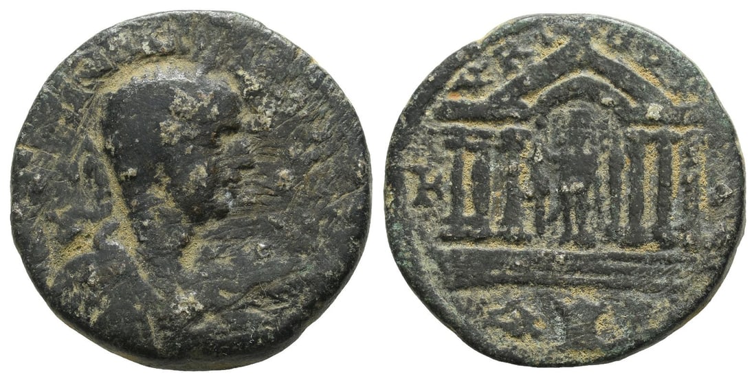 Elagabalus(?) AE 27mm of Tyre, Phoenicia.: AD 218-222. Laureate and cuirassed bust right, seen from behind / Hexastyle Temple of Astarte; within stands Astarte erecting a trophy, behind her stands Nike on a short column, placing a wreath on he