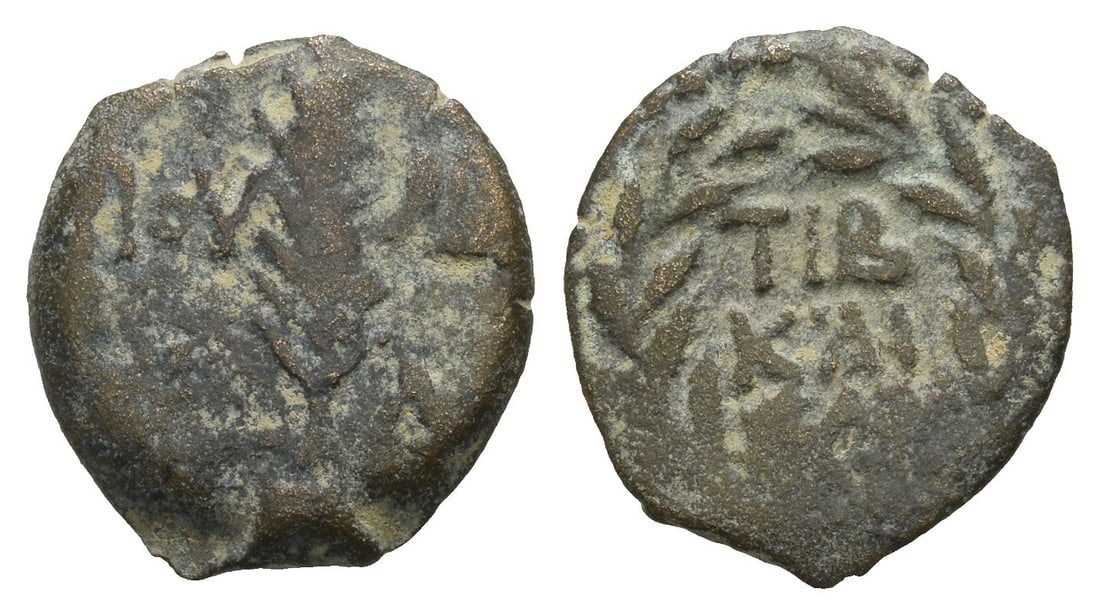 Judaea. Procurators, Valerius Gratus AE Prutah.: Dated RY 4 of Tiberius (17/8 CE). Jerusalem mint. In the names of Tiberius and Julia Augusta (Livia). Palm frond; IOY-?IA and L ? (date) across field / TIB KAICAP in three lines within wreath. RPC I, 