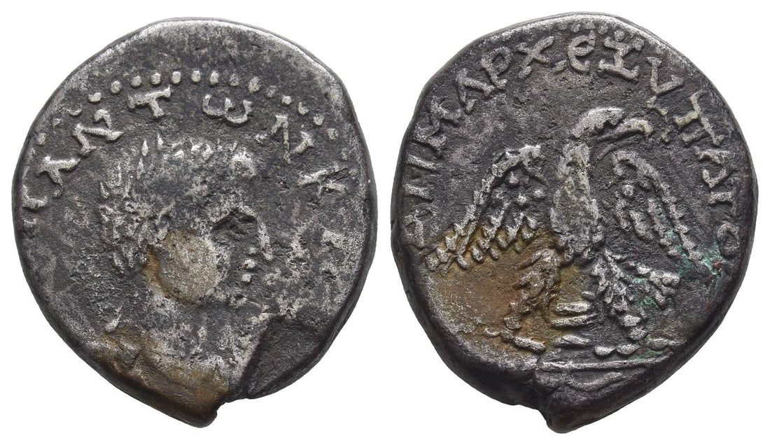 Diadumenian, as Caesar BI Tetradrachm of Aelia Capitolina, Judaea.: AD 217-218. bare-headed, draped and cuirassed bust to right / eagle standing facing on thyrsus, head and tail to right, with wings spread and holding wreath in beak; wine jug between legs. RPC V.3 Una