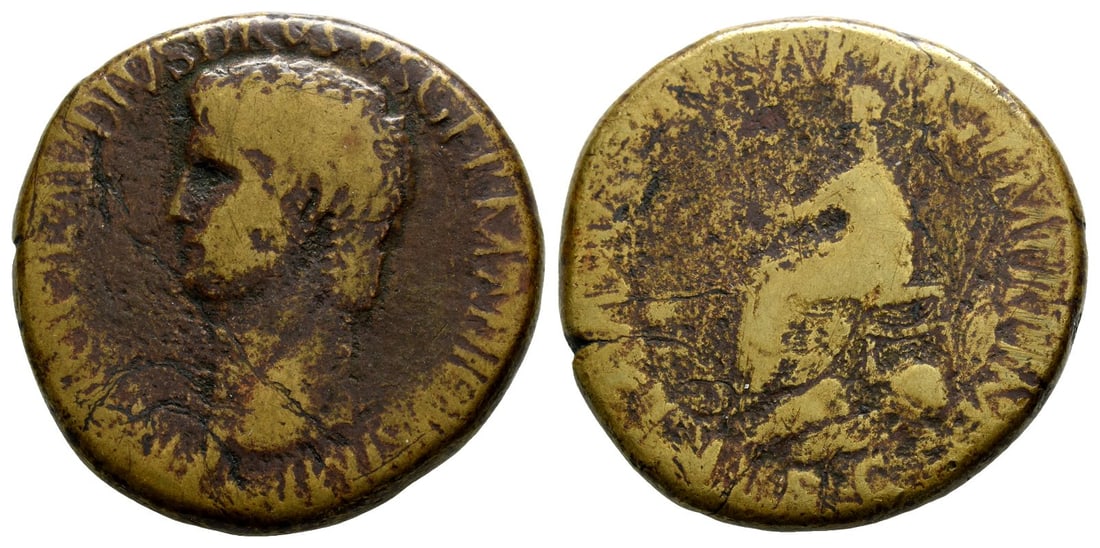 Nero Claudius Drusus AE Sestertius.: Struck under Claudius, AD 42-43. Rome mint. Bare head left / Claudius seated left on curule chair, holding branch and resting hand on lap; around the chair are scattered arms (spears, shields, cuirass