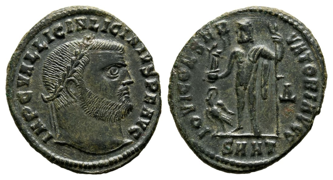 Licinius I BI Nummus.: AD 312. Heraclea mint. 4th officina. IMP C VAL LICIN LICINIVS P F AVG, laureate head to right / IOVI CONSERVATORI AVGG, Jupiter standing to left, chlamys across shoulder, holding Victory on globe and 