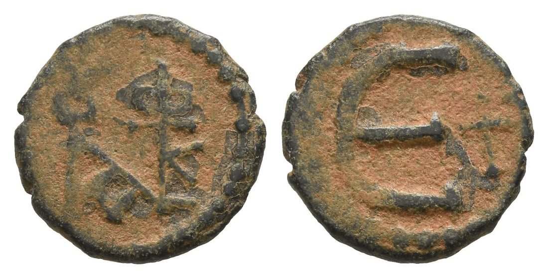 Justin II AE 5 Nummi or Pentanummium.: AD 565-578. Theoupolis (Antioch) mint. Monogram of Justin II / Large ?; in field to right, cross. DOC 186; MIB 65a; SB 386. 1.35gr, 13mm, 9h. Acquired on the German art market before 2000. Private col