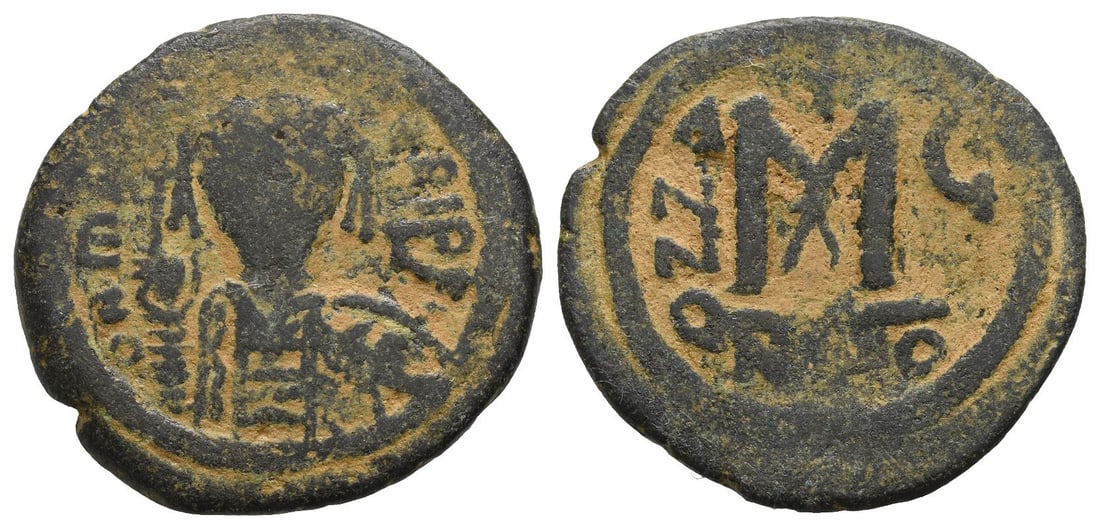 Maurice Tiberius AE 40 Nummi or Follis.: Dated RY 6 (AD 587/8). Nicomedia mint. 1st officina. [?] N ??[..]]RI P P, crowned and cuirassed facing bust, holding globus cruciger and shield / Large M; cross above, A N N O ? (date) across field; A