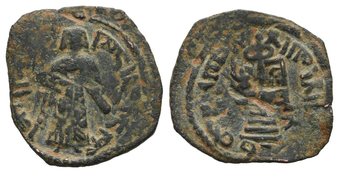 Umayyad Caliphate AE Fals.: Struck circa AH 70-81 (AD 690-700). Qinnasrin mint. Arab-Byzantine type. Standing Caliph coinage. Pre-reform issues, type I. Caliph standing facing, placing his right hand on the hilt of his sword, wh
