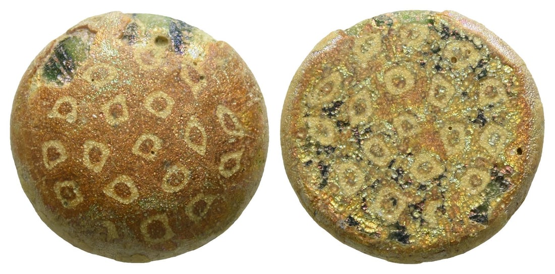 Roman Millefiori Glass Weight.: After circa 1st century AD. Yellow decorative patterns in brown glass weight. 2.84gr, 19mm, 12h. From the collection of a gentleman, acquired on the London art market in the 1990s. TimeLine Auctions f